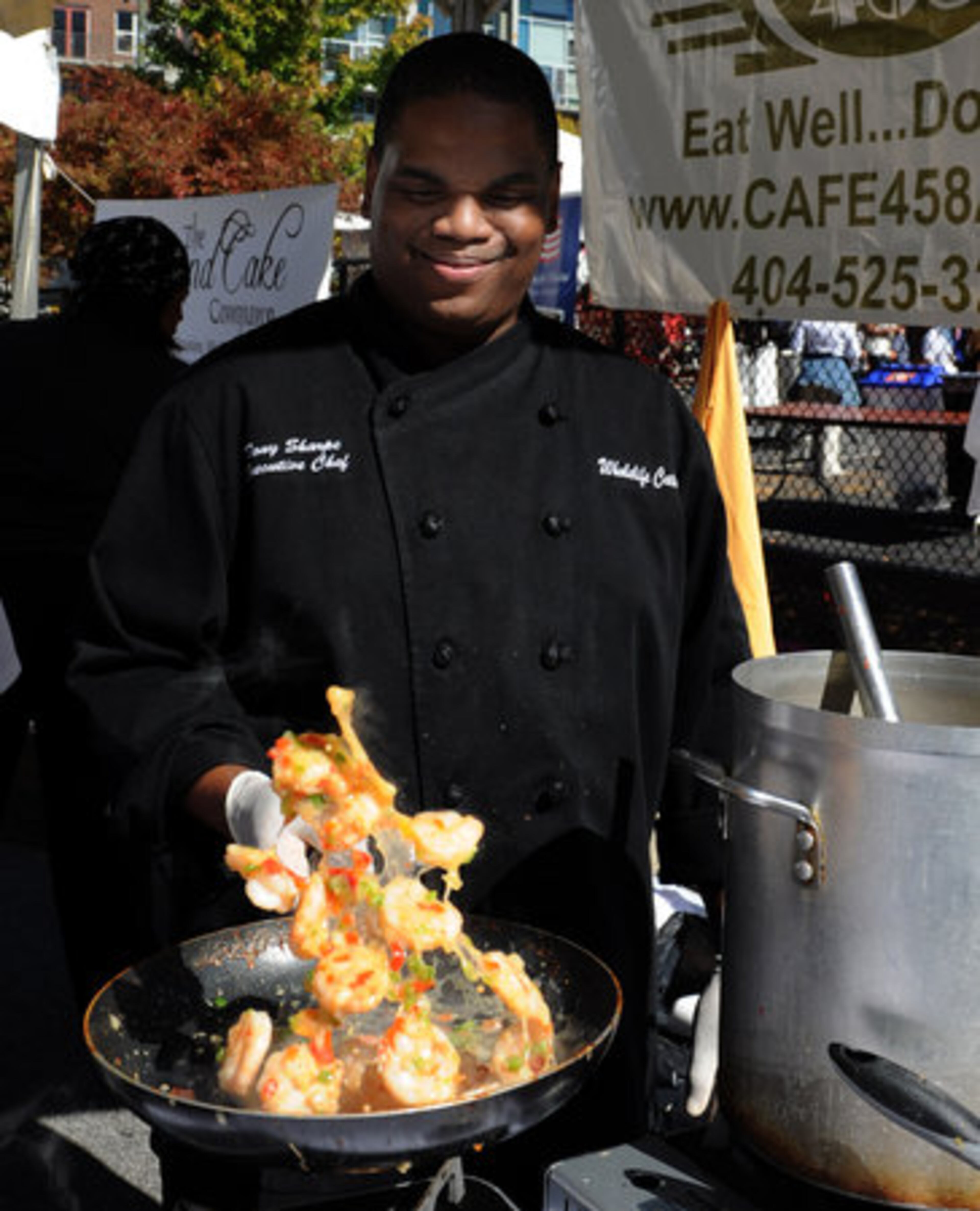Executive chef Tony Sharpe, of Cafe 458, cooks shrimp and grits during the Taste Of Atlanta event on Saturday, Oct. 23, 2010.