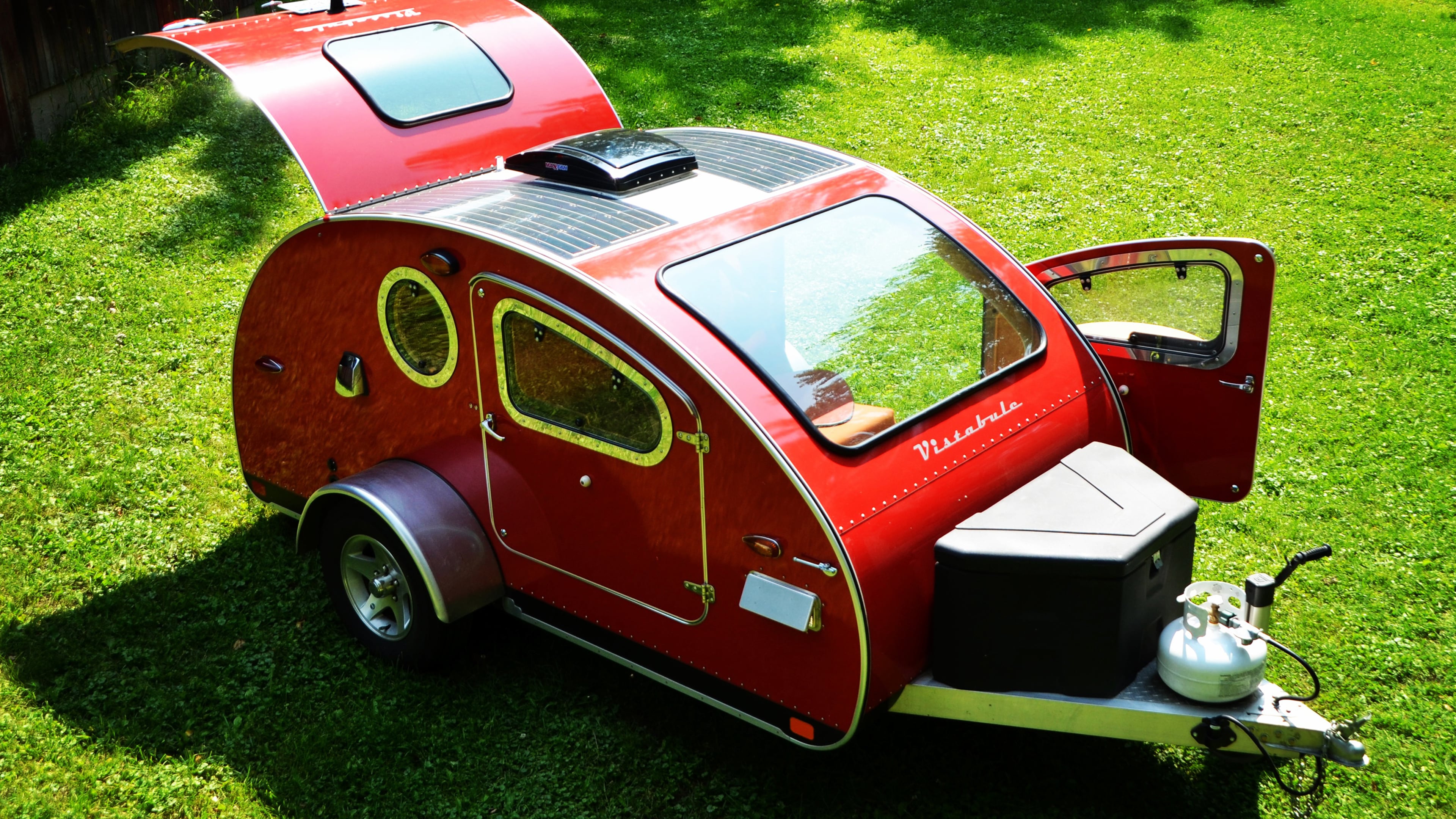 Vistabule red teardrop camper with solar at Belle Creek. (Courtesy of Vistabule )