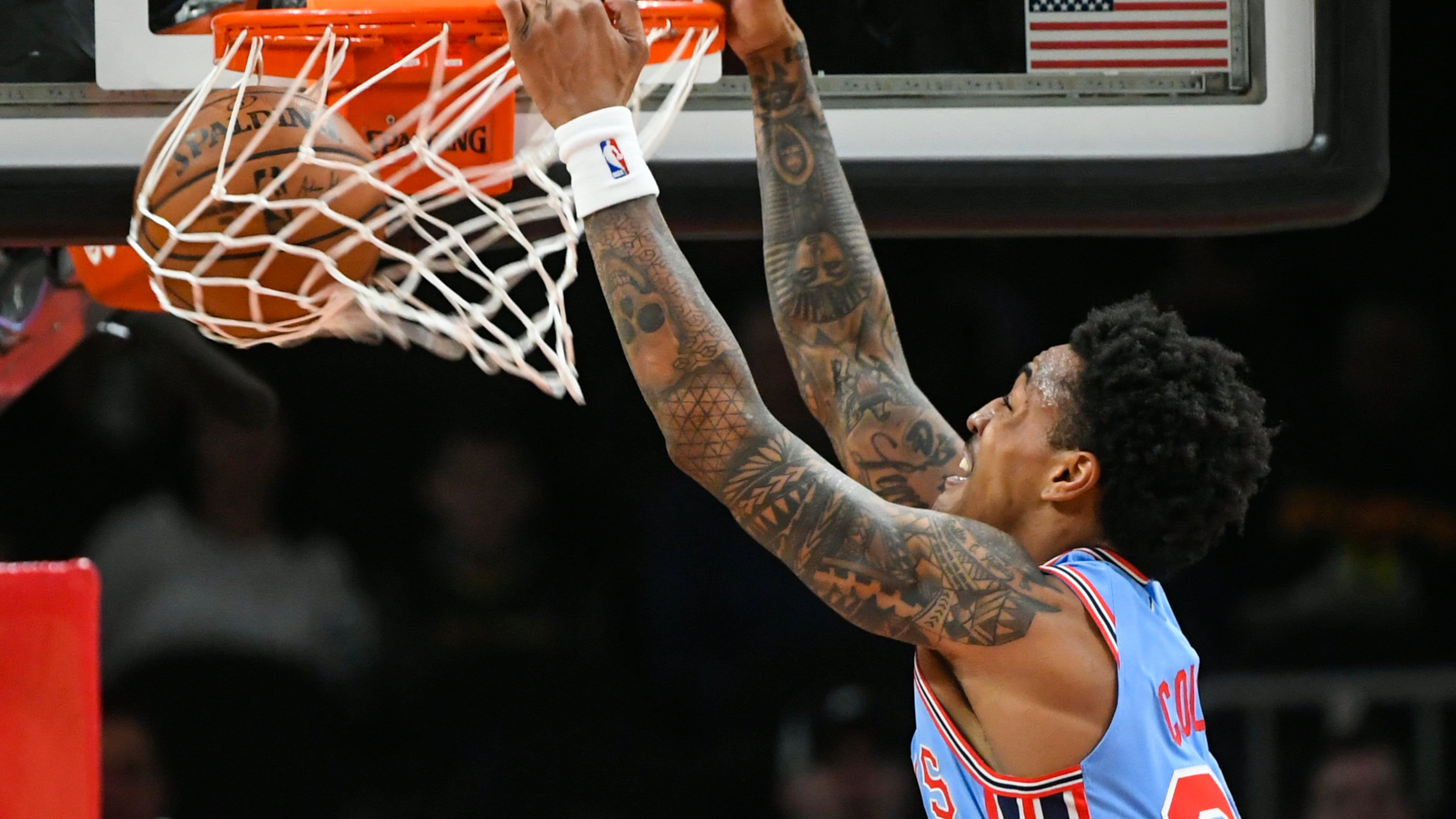 Hawks forward John Collins dunks on the Brooklyn Nets during the first quarter of an NBA basketball game, Saturday March 9, 2019, in Atlanta. (AP Photo/John Amis)