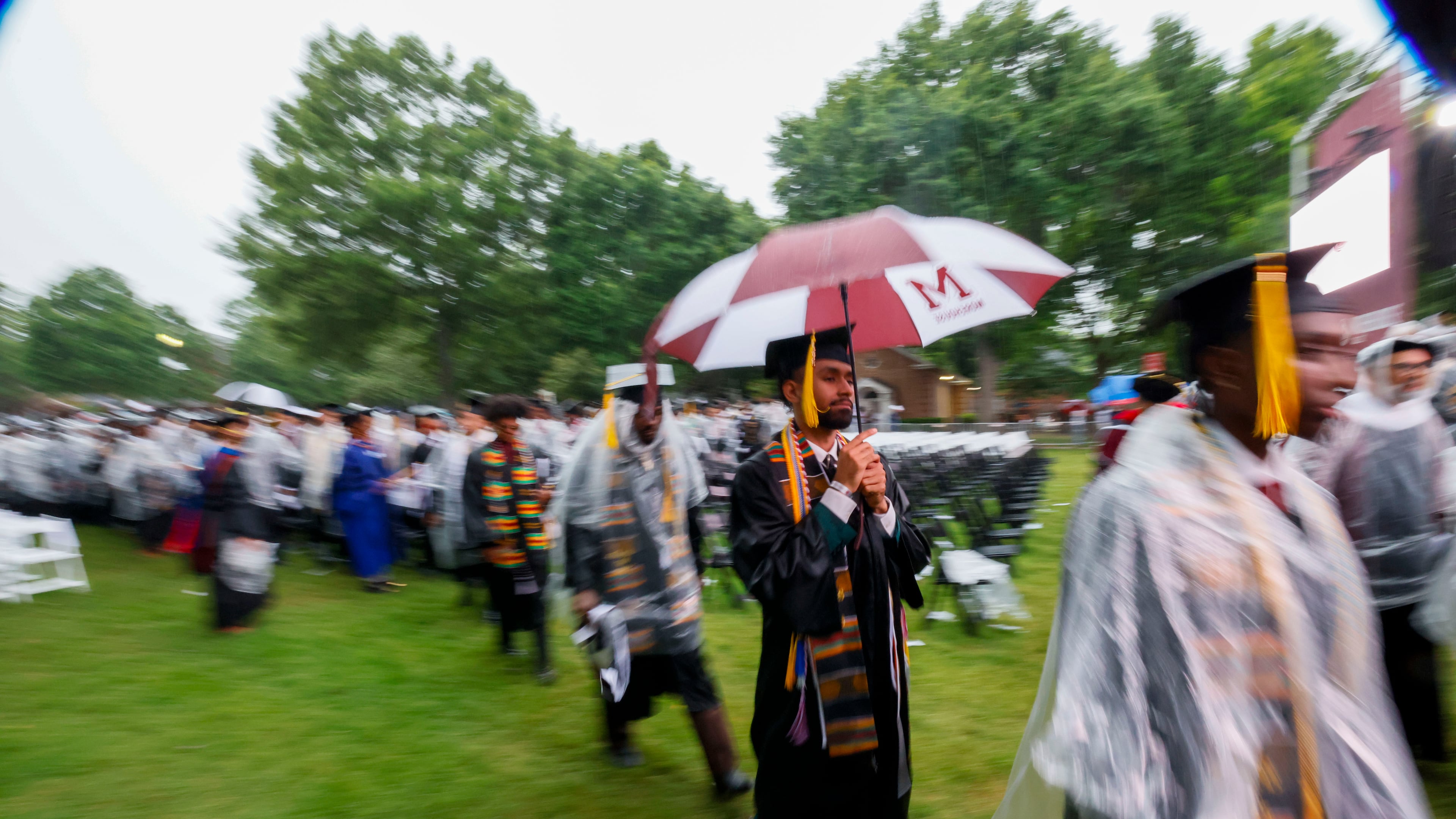 Graduates leave the ceremony as it moves indoors due to thunderstorms in the area during Morehouse College's 141st Commencement Ceremony on Sunday, May 18, 2025.
(Miguel Martinez/ AJC)