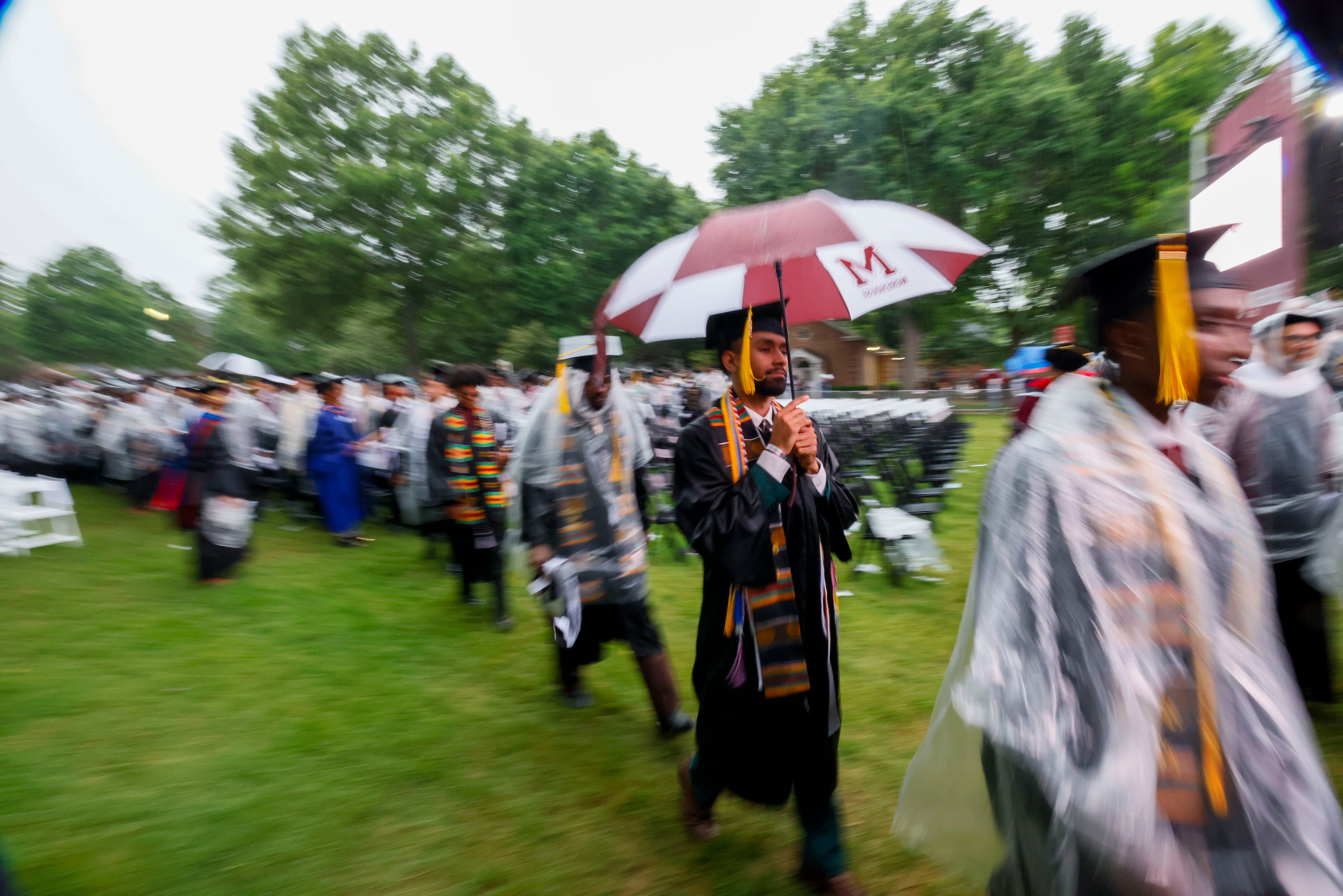 Graduates leave the ceremony as it moves indoors due to thunderstorms in the area during Morehouse College's 141st Commencement Ceremony on Sunday, May 18, 2025.
(Miguel Martinez/ AJC)