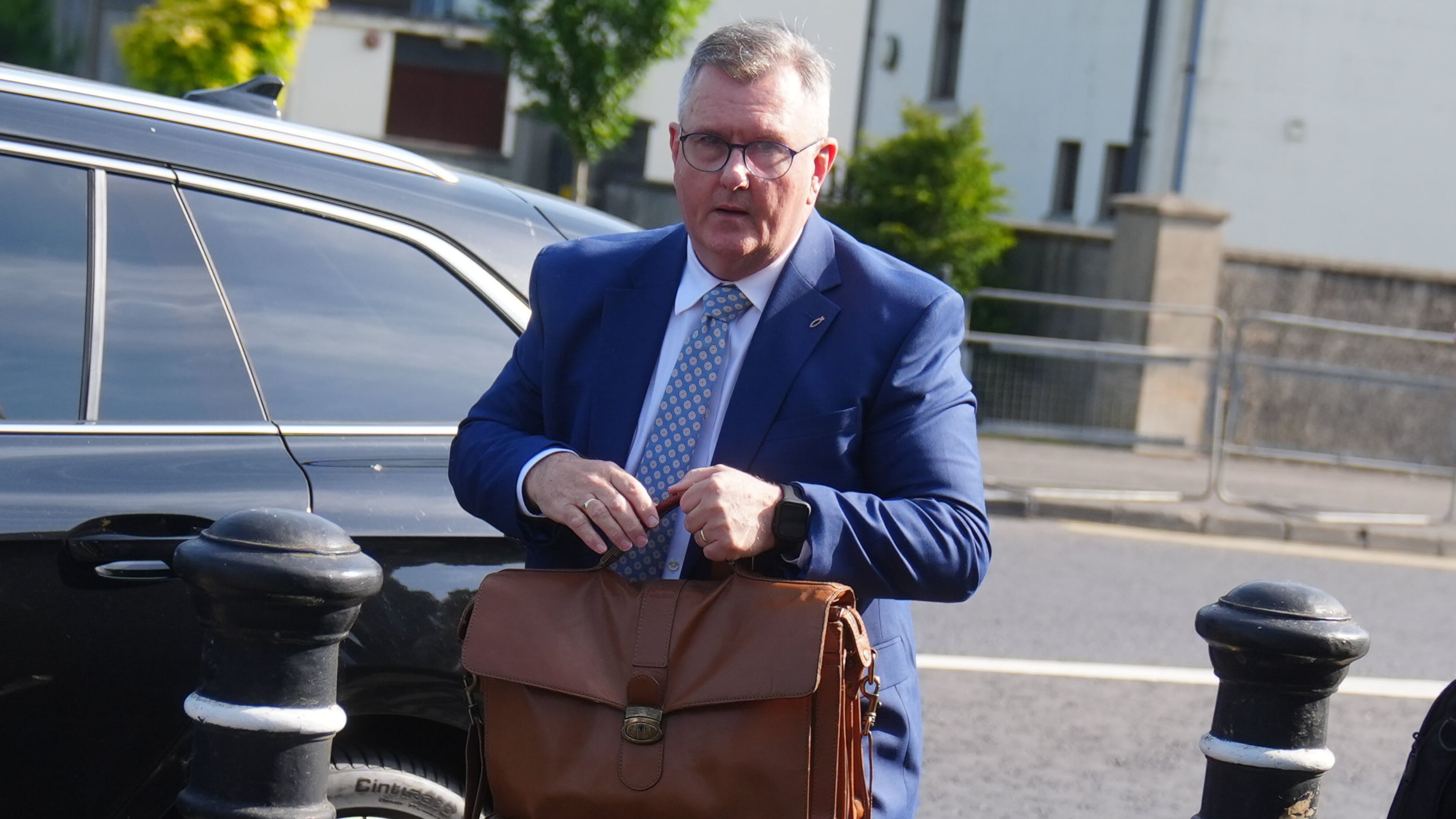 Jeffrey Donaldson arrives at Newry Crown Court, England, where he and his wife Eleanor Donaldson are accused of historical sexual offences, on Wednesday May 27, 2026. (Brian Lawless/PA via AP)