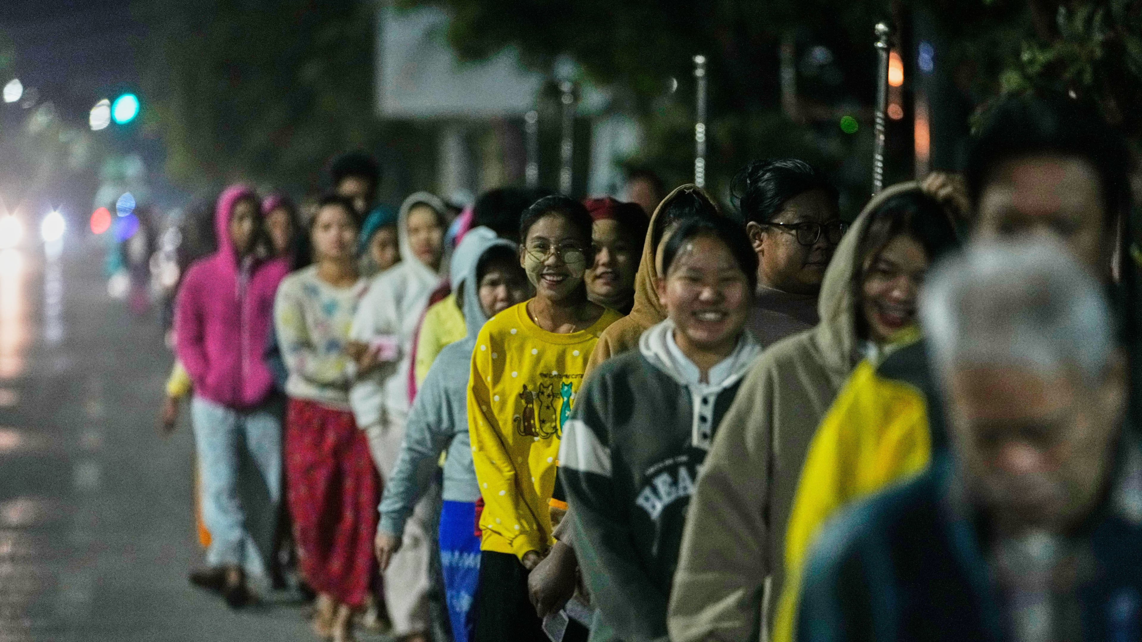 Voters wait for a polling station to open during the second phase of general election in Mandalay, central Myanmar, Sunday, Jan. 11, 2026. (AP Photo/Aung Shine Oo)