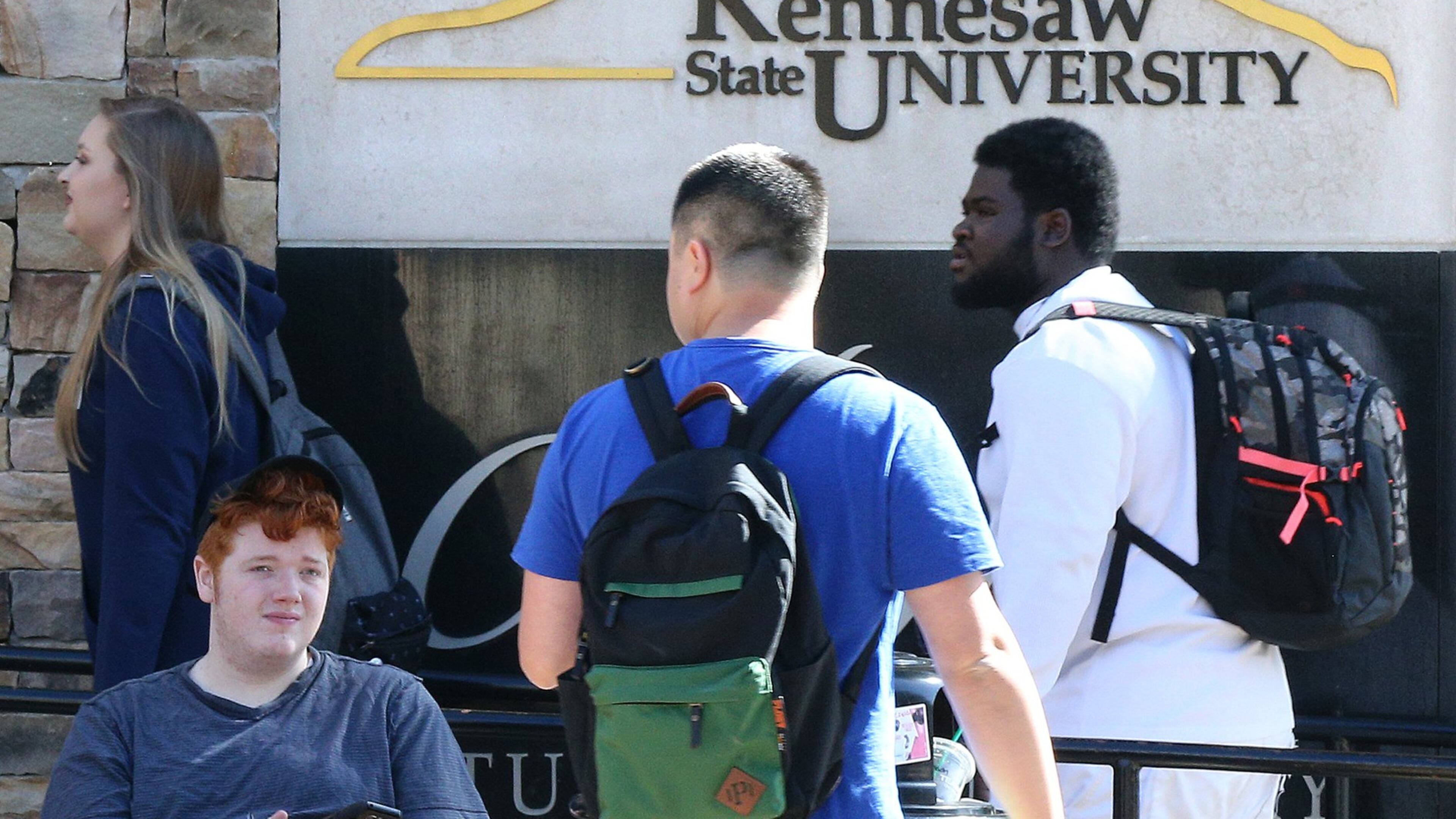 Students make their way across campus at the commons area of Kennesaw State University on Thursday, Oct. 12, 2017, in Kennesaw. Curtis Compton/ccompton@ajc.com