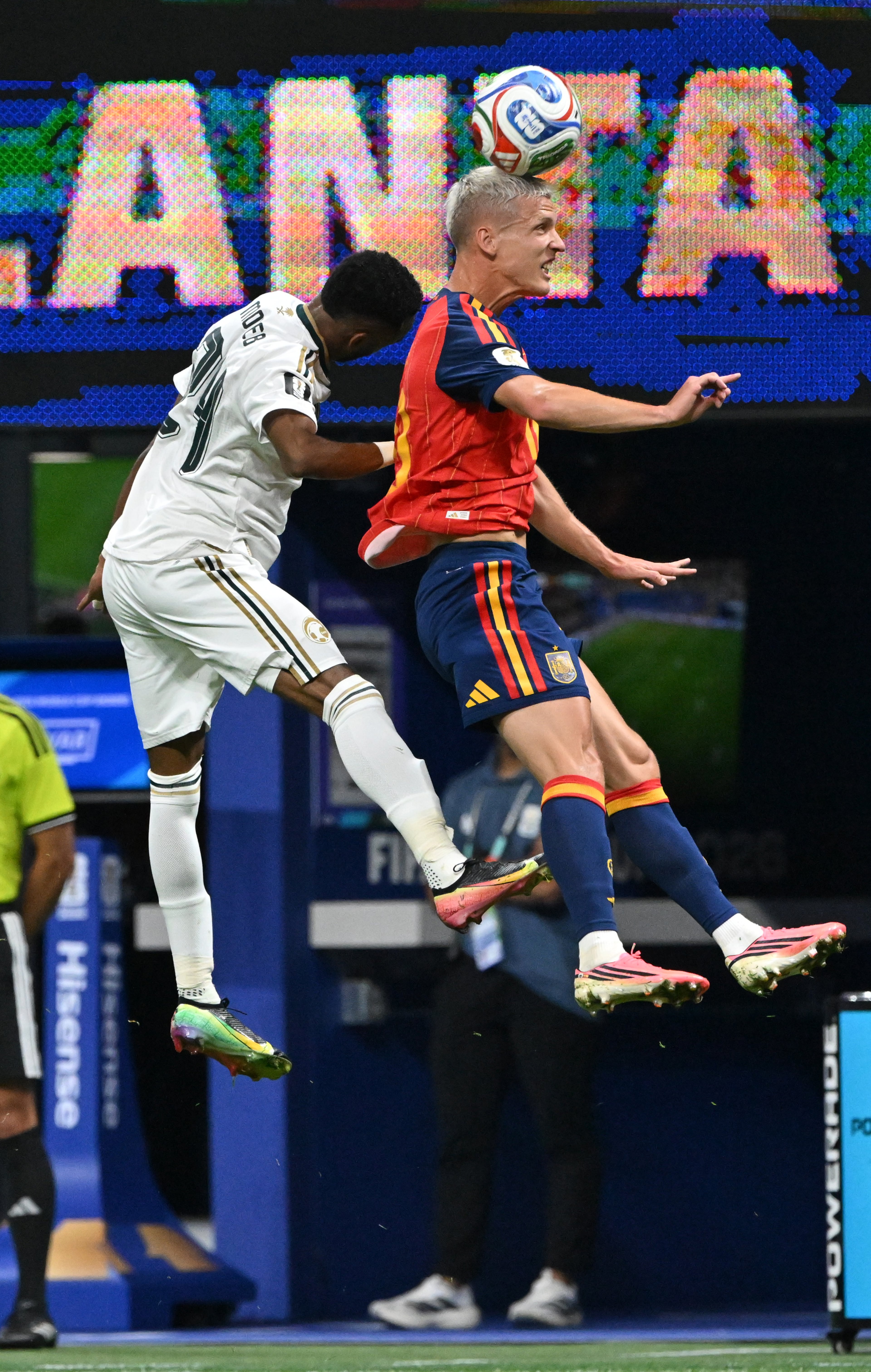 Saudi Arabia's Moteb Al-Harbi (left) and Spain's Dani Olmo battle for a header during the first half of the Spain vs. Saudi Arabia World Cup match Sunday, June 21, 2026, at Atlanta Stadium. (Hyosub Shin/AJC)
