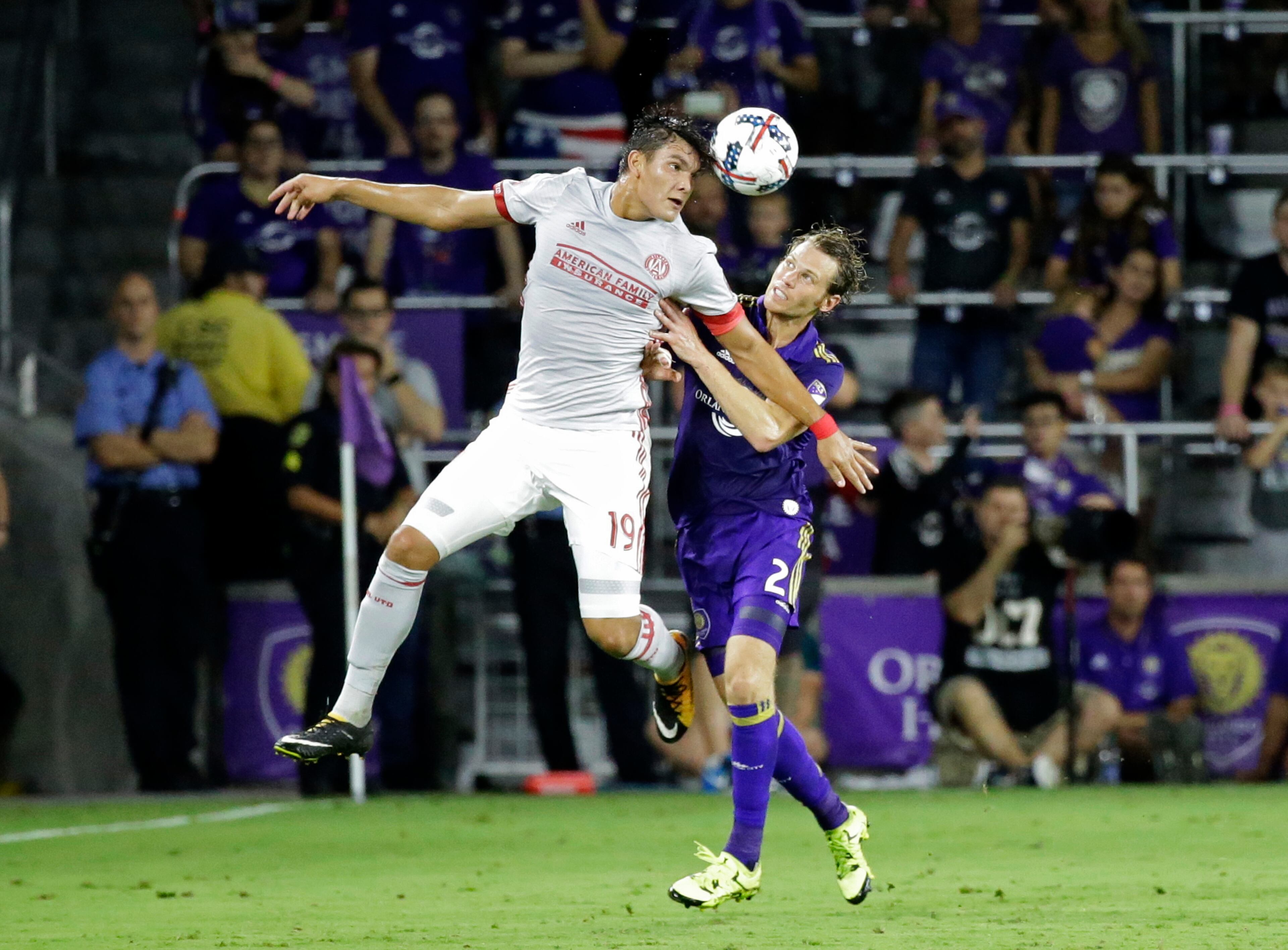 Atlanta United's Brandon Vazquez (19) heads the ball away from Orlando City's Jonathan Spector (2) during the second half of an MLS soccer match, Friday, July 21, 2017, in Orlando, Fla. Atlanta United won 1-0. (AP Photo/John Raoux)