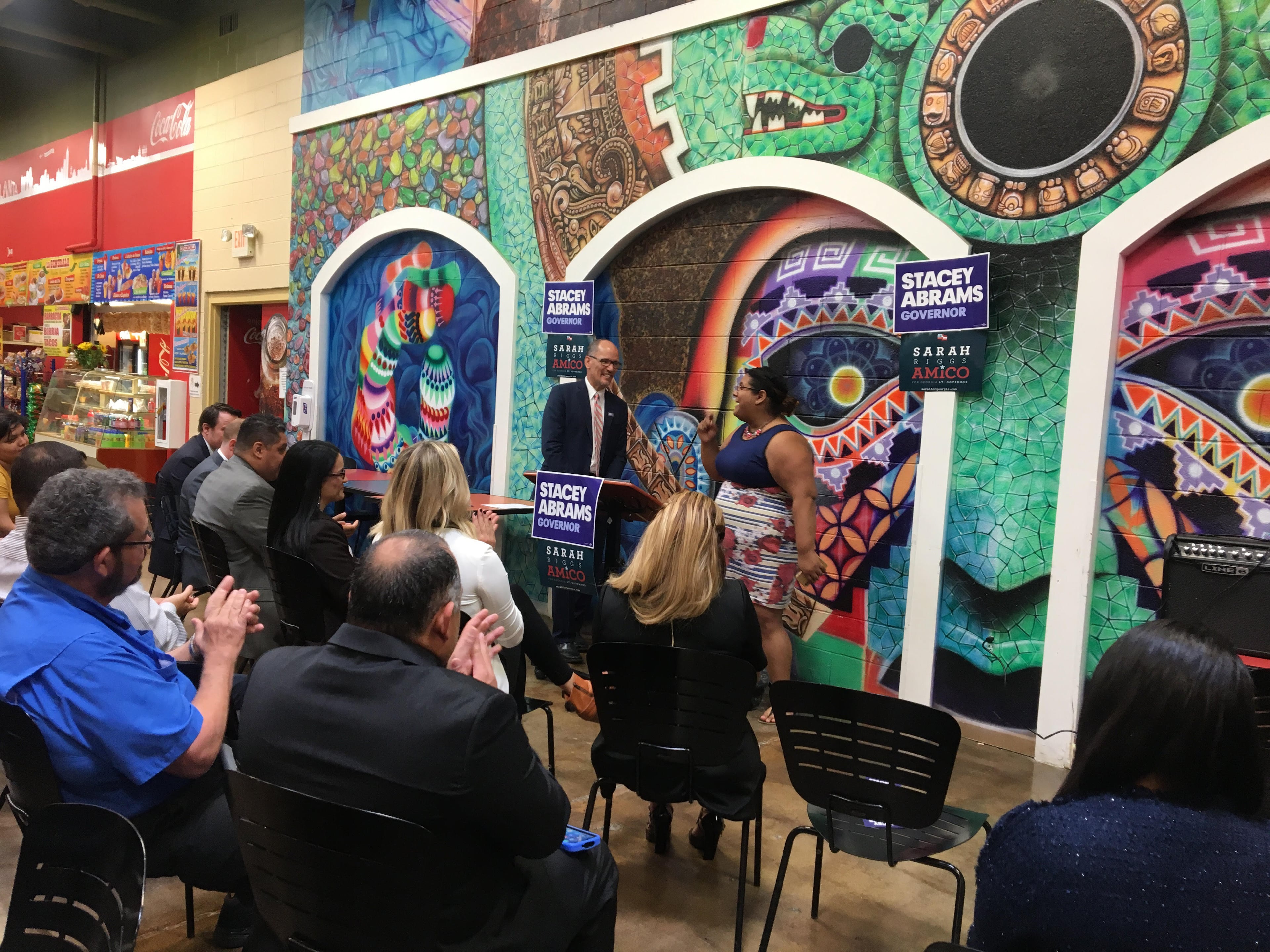 Democratic National Committee Chairman Tom Perez (left) and Genny Castillo, Latinx constituency director for the Coordinated Campaign of the Georgia Democratic Party, address Hispanic voters and candidates at Plaza Fiesta on Buford Highway. (Courtesy of Amanda C. Coyne)