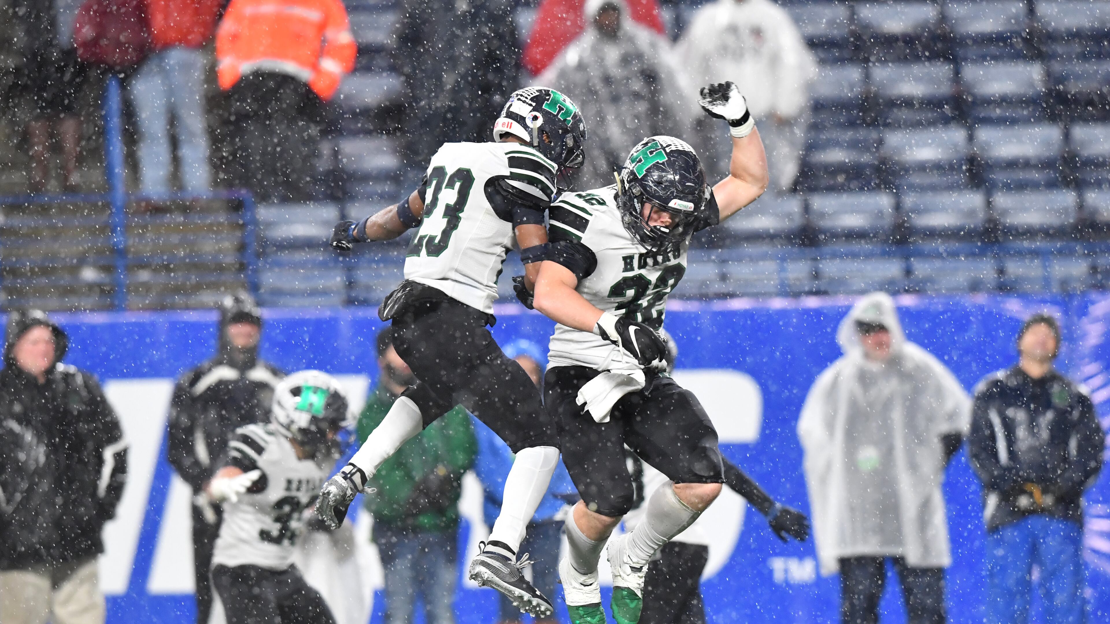 Harrison's Brandon Carter (23) and Marcus Bleazard (32) celebrate in the second half during the AAAAAA state championship game Friday, Dec. 13, 2019, at Georgia State Stadium in Atlanta. Harrison won 20-7 over Allatoona.