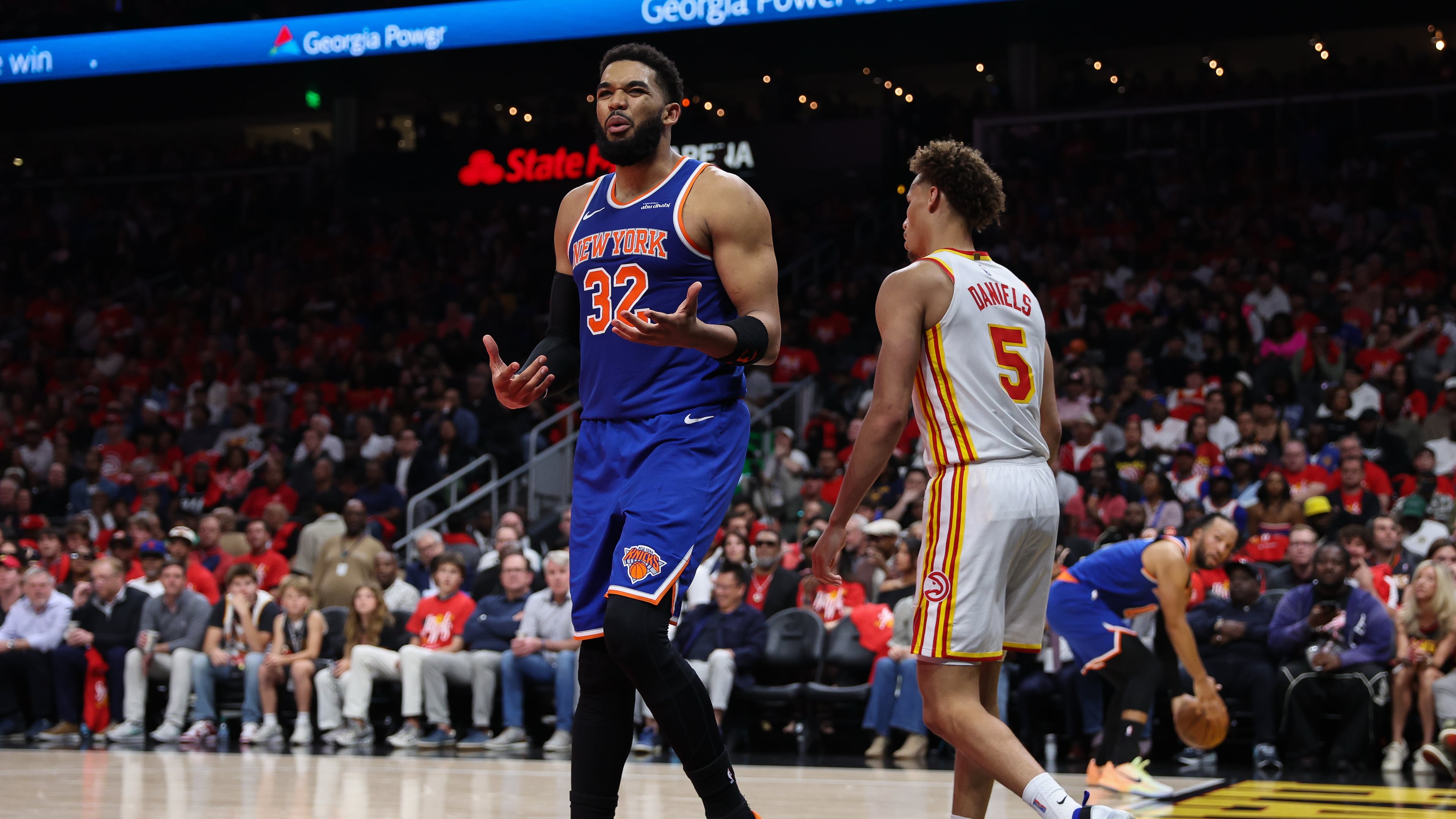 New York Knicks center Karl-Anthony Towns (32) reacts during the first half in Game 3 of a first-round NBA playoffs basketball series against the Atlanta Hawks, Thursday, April 23, 2026, in Atlanta. (AP Photo/Colin Hubbard)
