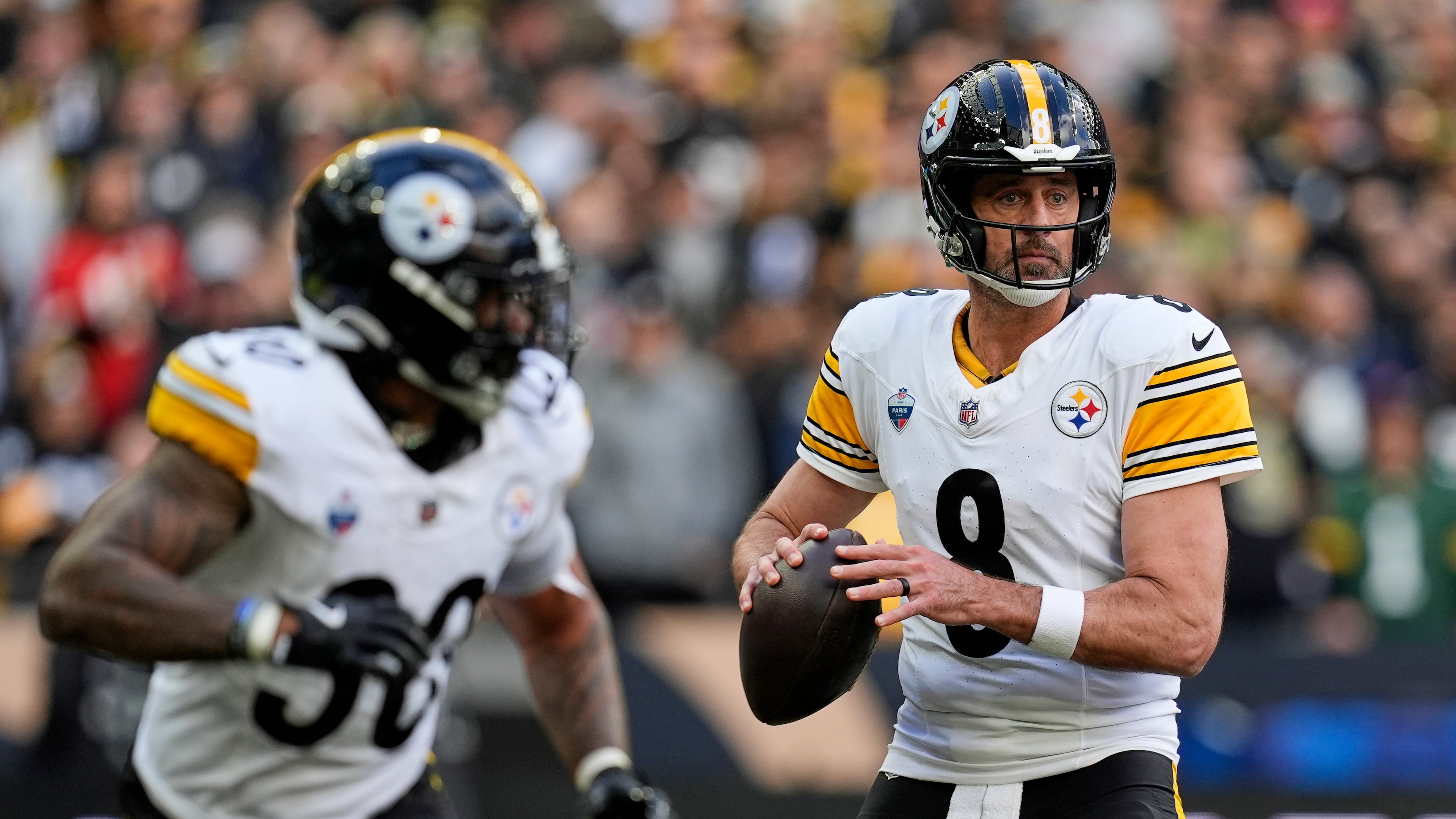 Pittsburgh Steelers quarterback Aaron Rodgers (8) looks to pass during an NFL football game against New Orleans Saints in Saint-Denis, outside Paris, Sunday, Oct. 25, 2026. (AP Photo/Steve Luciano)