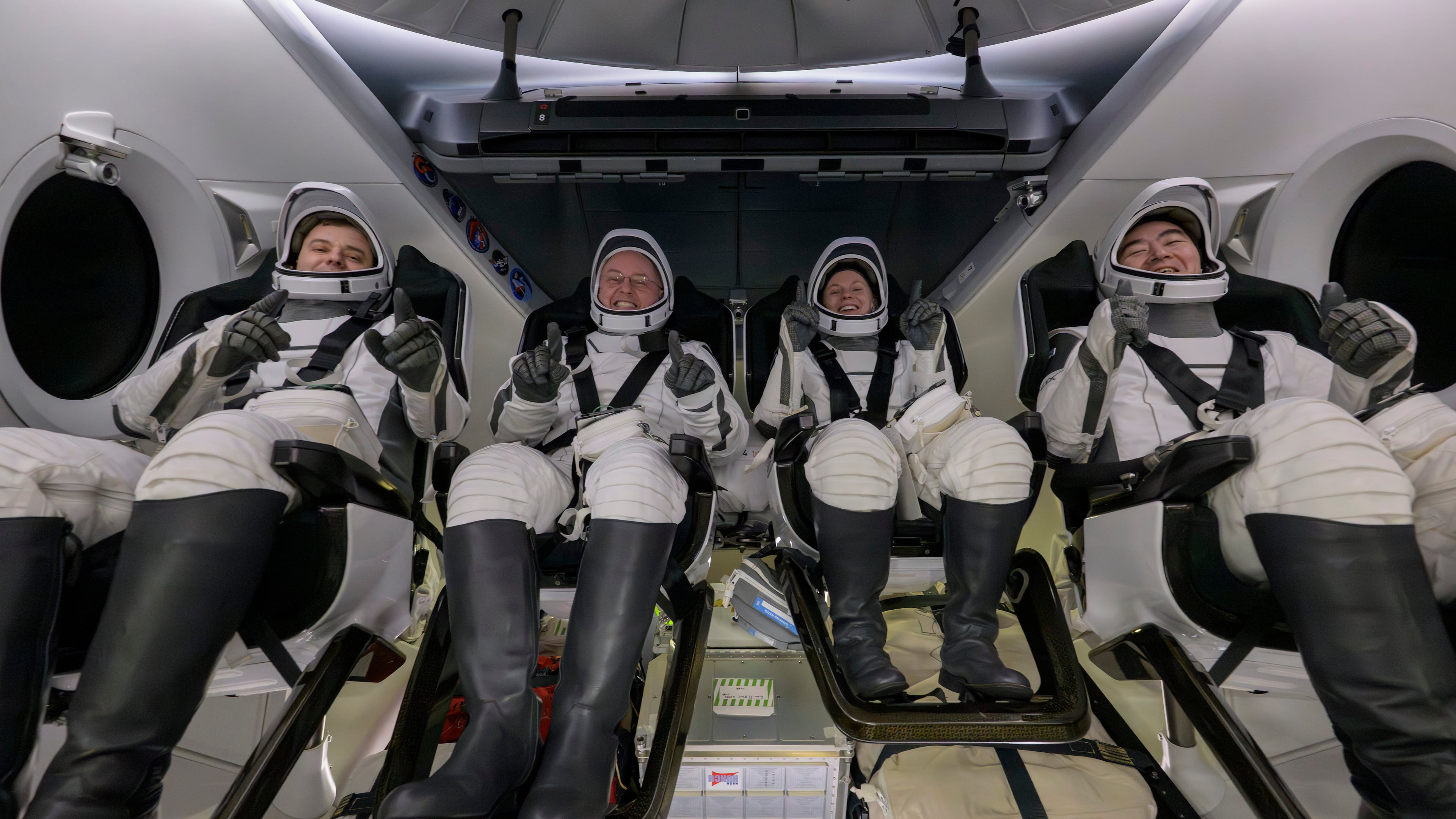 Roscosmos cosmonaut Oleg Platonov, left, NASA astronauts Mike Fincke, Zena Cardman, and JAXA (Japan Aerospace Exploration Agency) astronaut Kimiya Yui are seen inside the SpaceX Dragon Endeavour spacecraft onboard the SpaceX recovery ship SHANNON shortly after having landed in the Pacific Ocean off the coast of Long Beach, Calif., Thursday, Jan. 15, 2026. (NASA via AP)