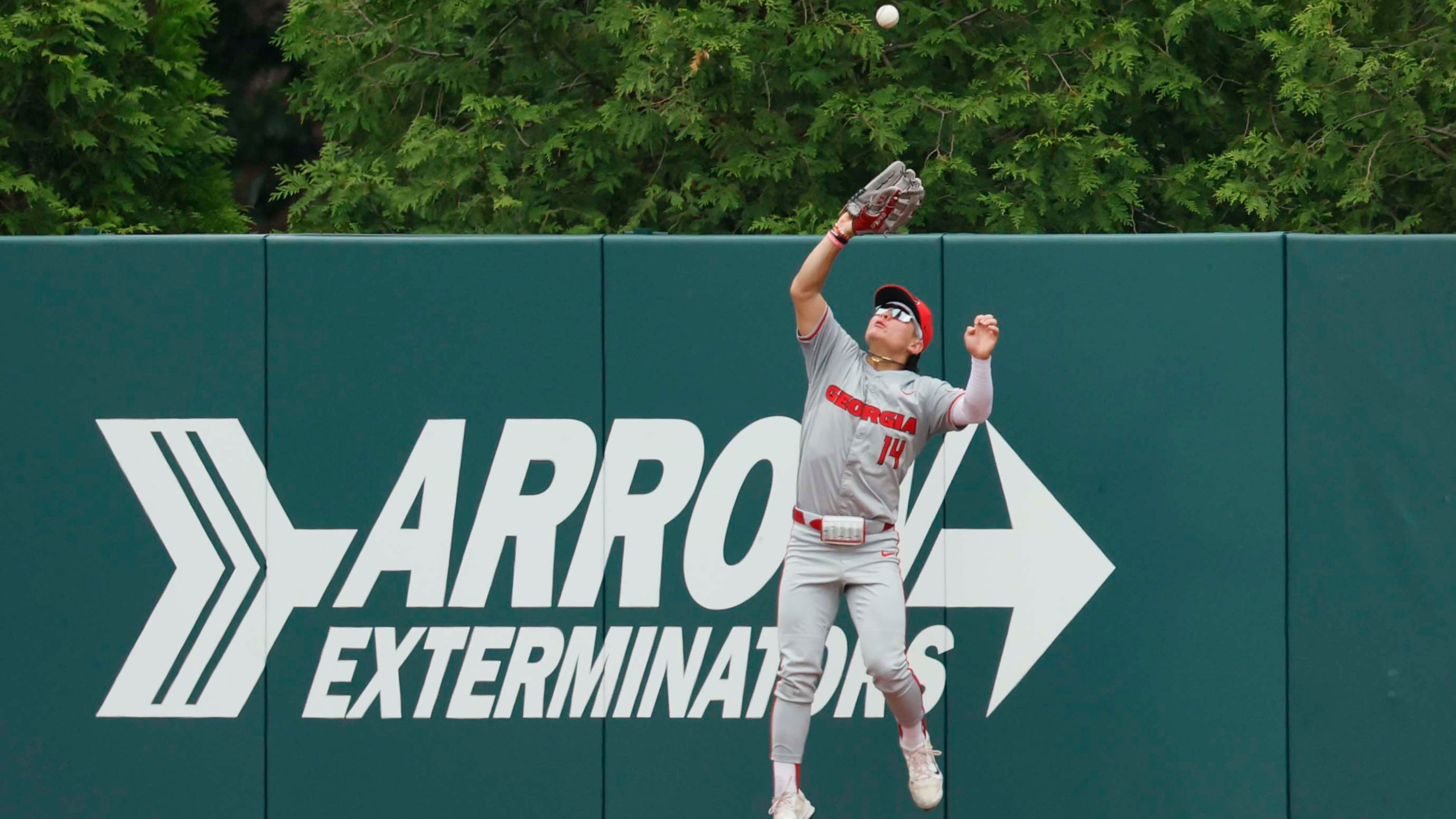 Georgia Bulldog Kenny Ishikawa goes up to make a catch for an out during the third inning of their Game 2 of the NCAA Super Regional at Foley Field on Sunday, June 7, 2026, in Athens. (Miguel Martinez/AJC)