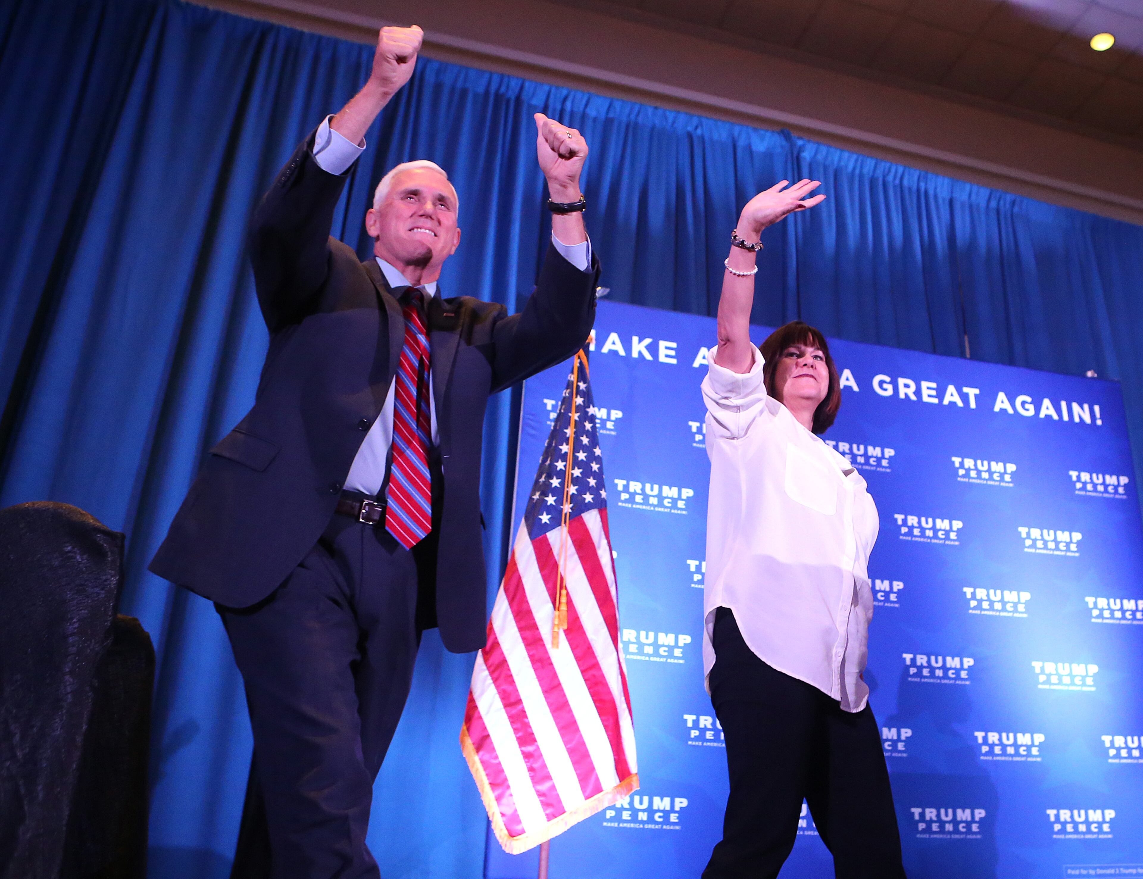 Republican Vice Presidential nominee Mike Pence and his wife Karen wave to the crowd Monday, August 29, 2016, during a campaign stop in Marietta. Curtis Compton /ccompton@ajc.com