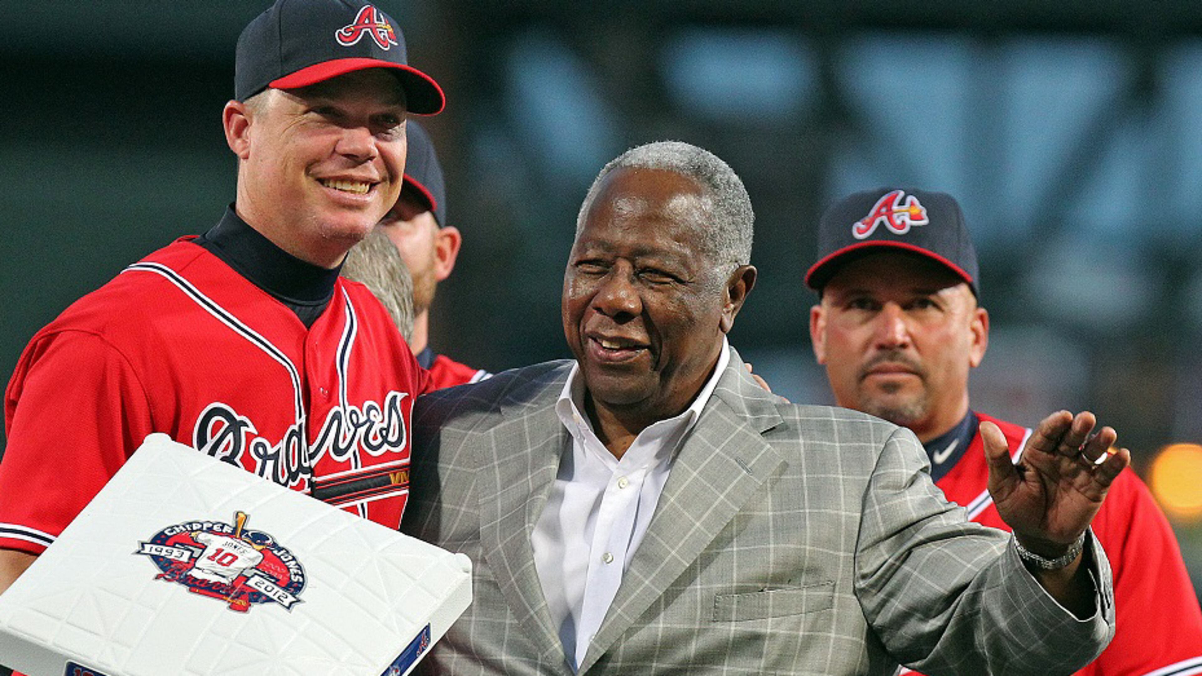 Braves Hall of Famer Hank Aaron presents certain future Hall of Famer Chipper Jones with third base during his tribute night at Turner Field in Atlanta on Friday , Sept. 28, 2012. CURTIS COMPTON / CCOMPTON@AJC.COM