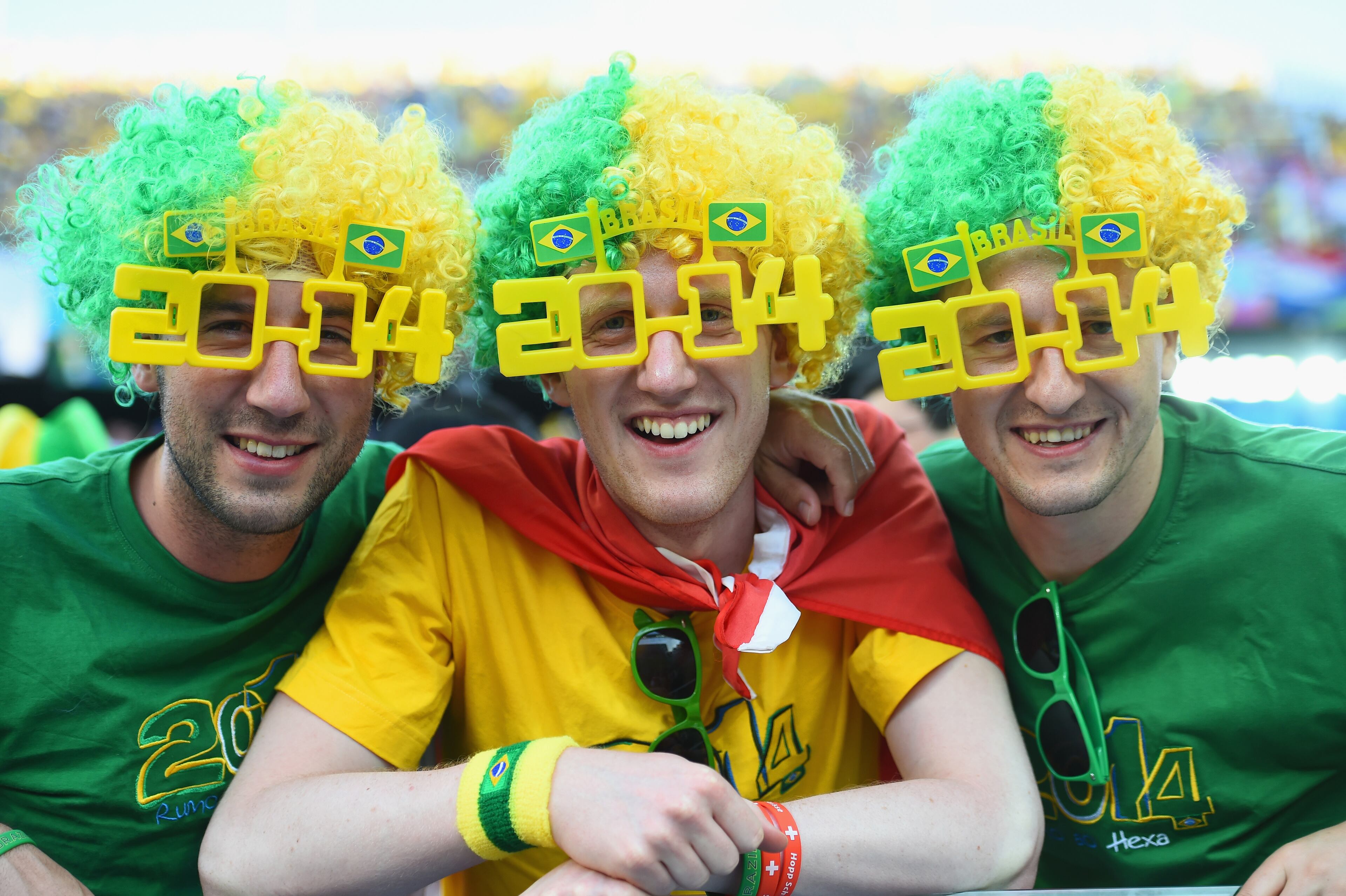 SAO PAULO, BRAZIL - JUNE 12: Fans in 2014 shaped glasses pose before the 2014 FIFA World Cup Brazil Group A match between Brazil and Croatia at Arena de Sao Paulo on June 12, 2014 in Sao Paulo, Brazil. (Photo by Christopher Lee/Getty Images)
