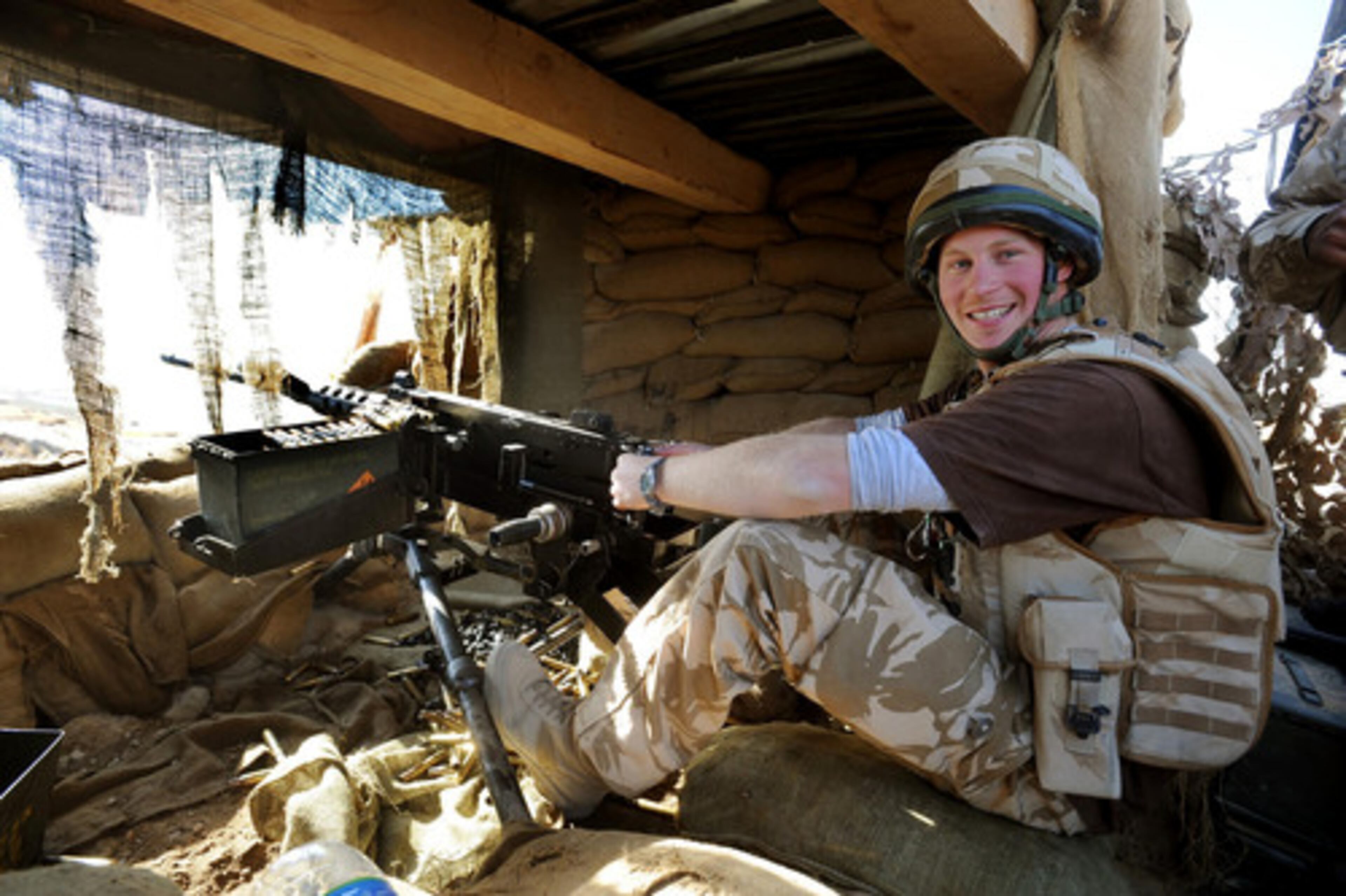 Britain's Prince Harry mans a .50 caliber machine gun, at an observation post close to Forward Operating Base Delhi, in Afghanistan, on Wednesday Jan. 2, 2008.