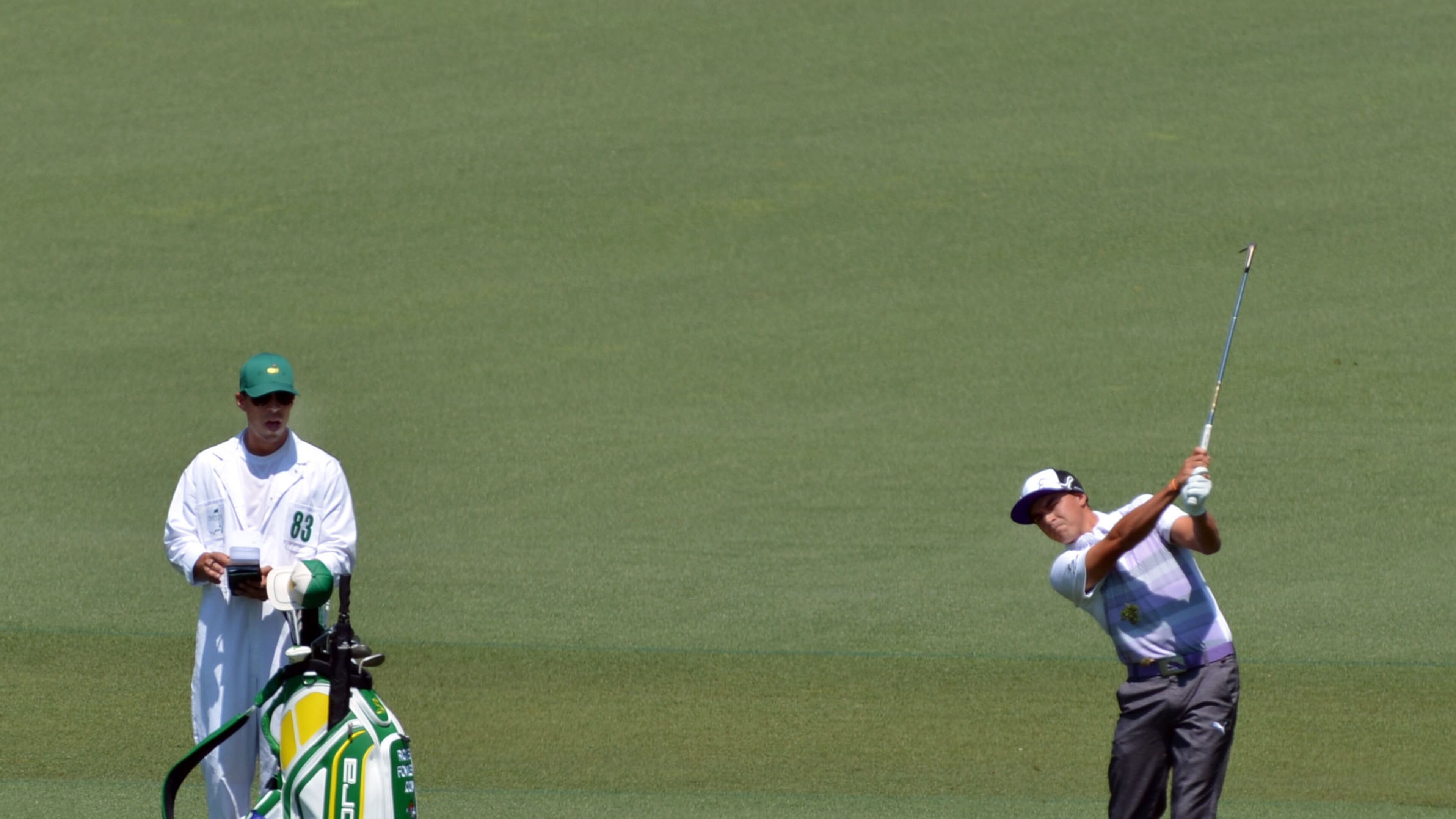 Rickie Fowler hits in the #2 fairway during the third round of the Masters Tournament Saturday, April 12, 2014, at Augusta National Golf Club.