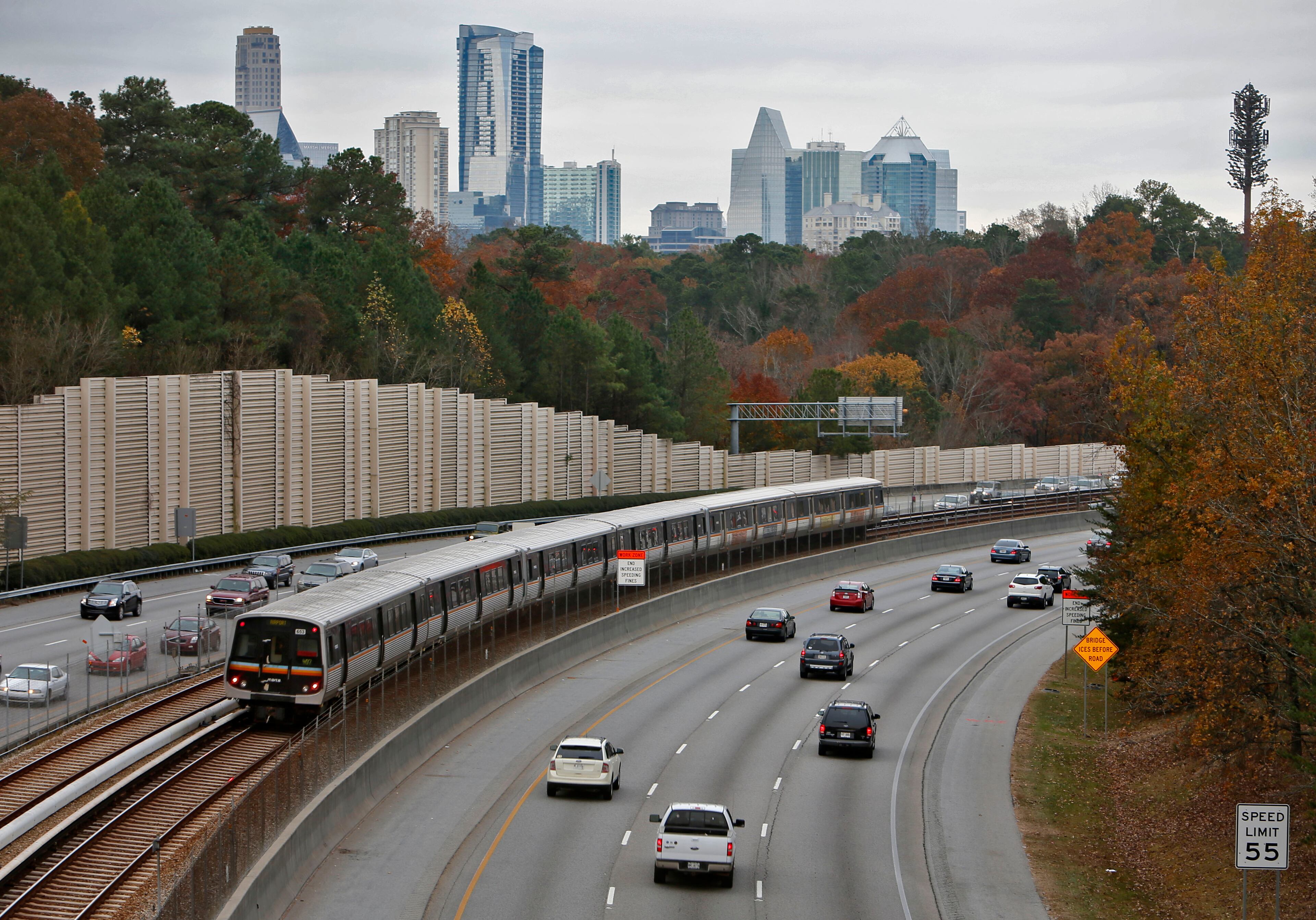Morning commute traffic on GA 400 in the toll booth area. GA 400 tolls will end Nov. 22. BOB ANDRES / BANDRES@AJC.COM