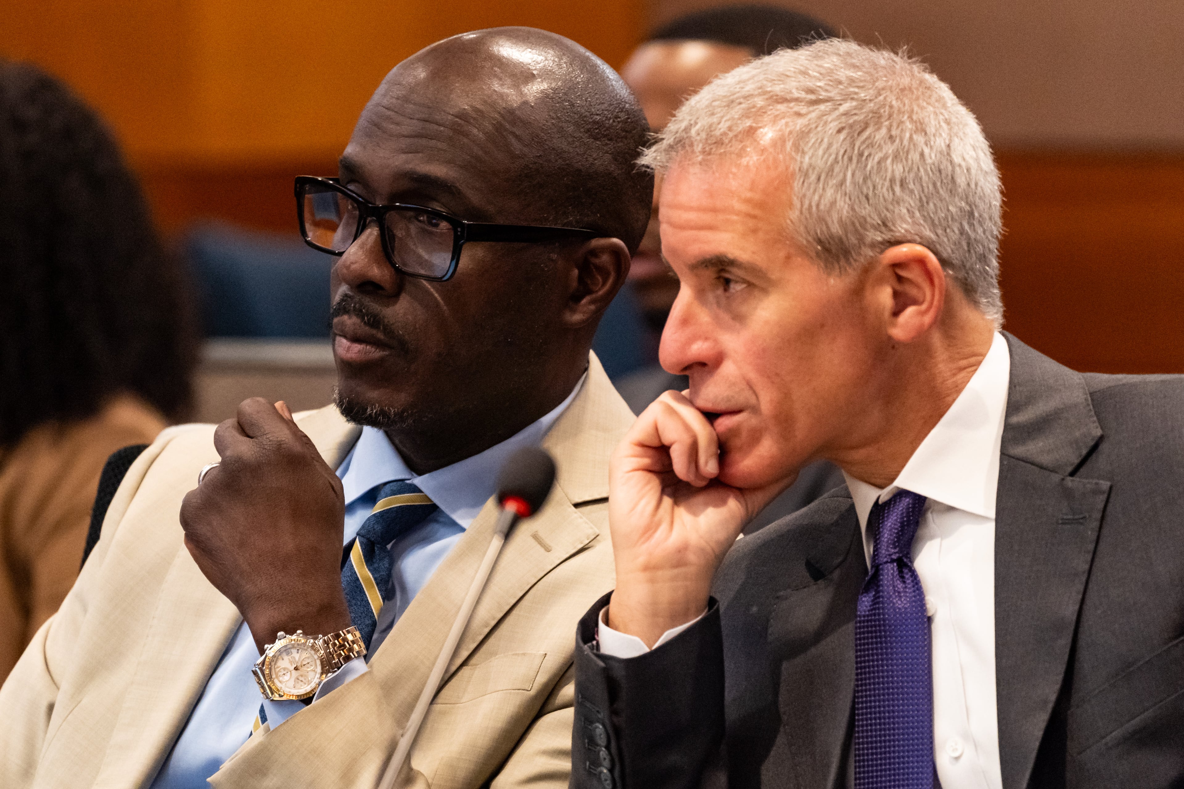 Young Thug attorney Keith Adams, left, confers with Young Thug attorney Brian Steel during the ongoing “Young Slime Life” gang trial at the Fulton County Courthouse in Atlanta on Friday, July 19, 2024. (Seeger Gray/AJC)