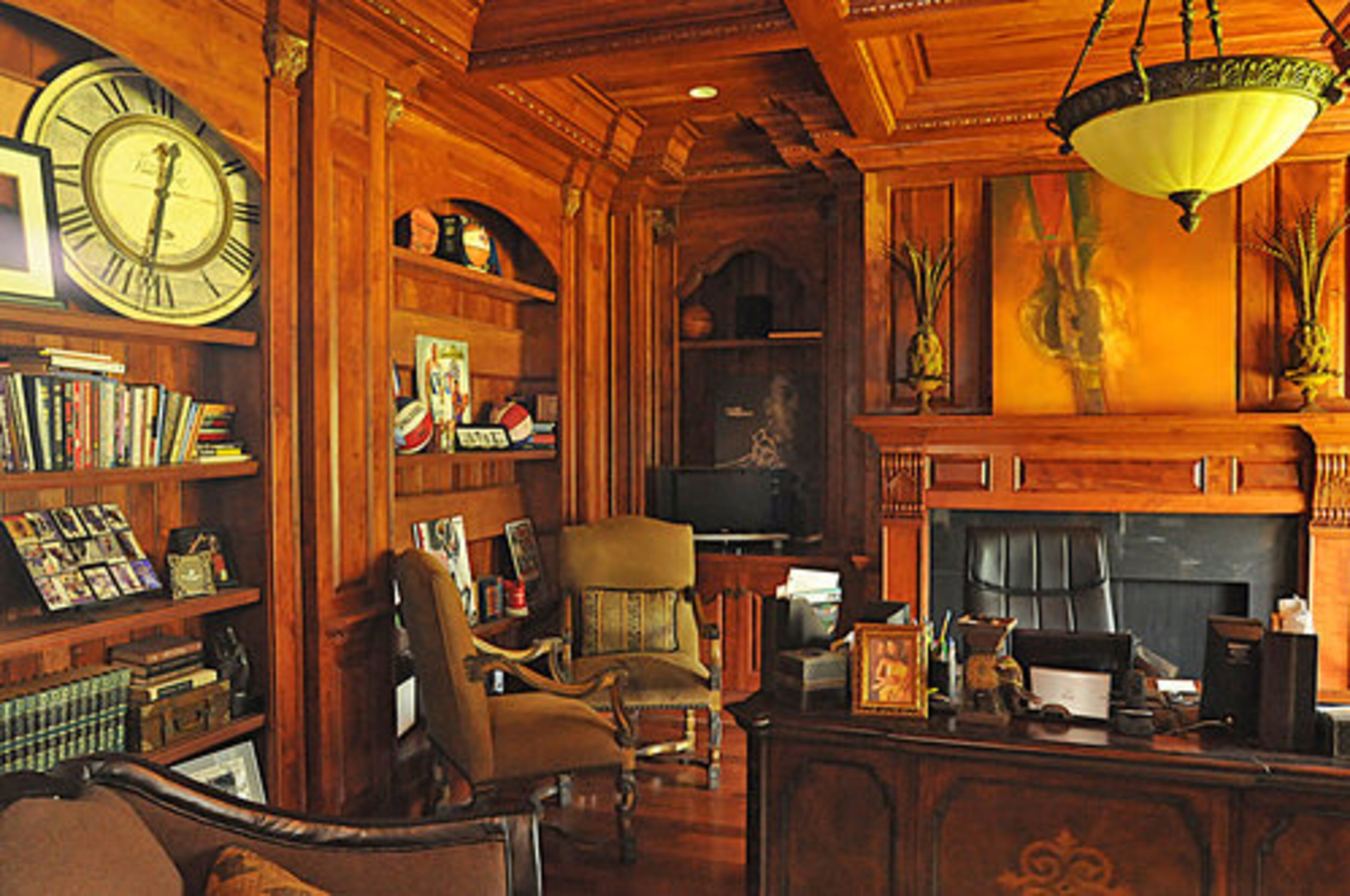 Antonio's handsome office, dotted with sports memorabilia. Antonio, best known for his stellar play as a power forward for the Indiana Pacers, remains heavily involved in the game post-retirement. He serves as regional director of player programs for the NBA Players Association. He's also the coach of the Georgia Ice.