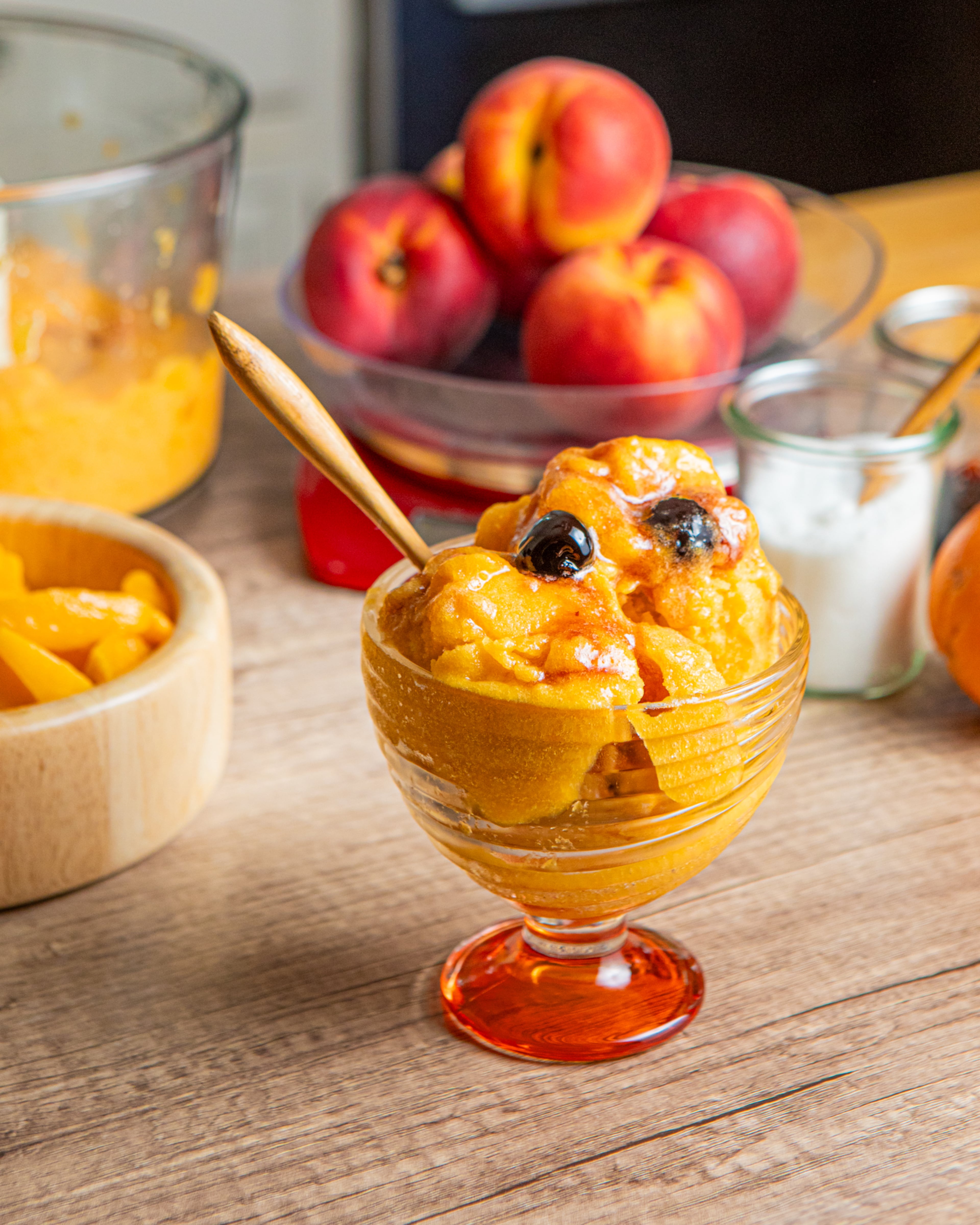 This Peach & Bourbon Sorbet gets its Southern cocktail flavor from bourbon vanilla extract and maraschino cherries. (Aaliyah Man for the AJC. Food styling by Jennifer Hill Booker)