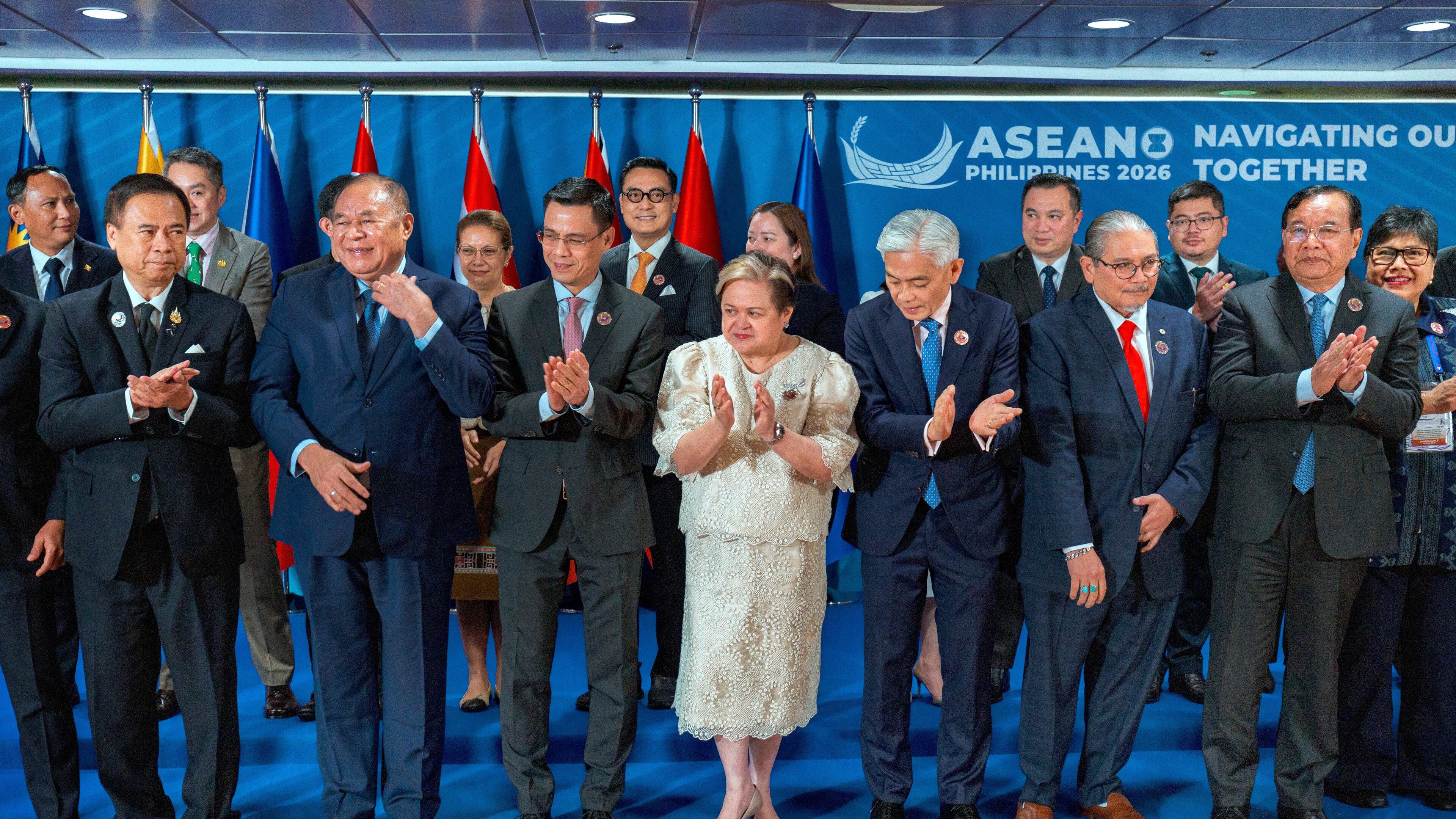Front row, from left, Thailand Deputy Prime Minister and Foreign Minister Sihasak Phuangketkeow, Timor-Leste Foreign Minister Bendito dos Santos Freitas, Vietnam Deputy Foreign Minister Dang Hoang Giang, Philippines Foreign Secretary Theresa Lazaro, Singapore Permanent Secretary of Foreign Affairs Albert Chua, Brunei Foreign Minister Erywan Yusof, Cambodia Deputy Prime Minister and Foreign Minister Prak Sokhonn, and Indonesia Director General for ASEAN Cooperation Ina Hagniningtyas Krisnamurthi clap after posing for a photo with representatives from the ASEAN Intergovernmental Commission on Human Rights (AICHR) Representatives during the ASEAN Foreign Ministers' Meeting at the Philippine International Convention Center, Monday July 20, 2026 in Pasay, Metro Manila, Philippines. (Ezra Acayan/Pool Photo via AP)