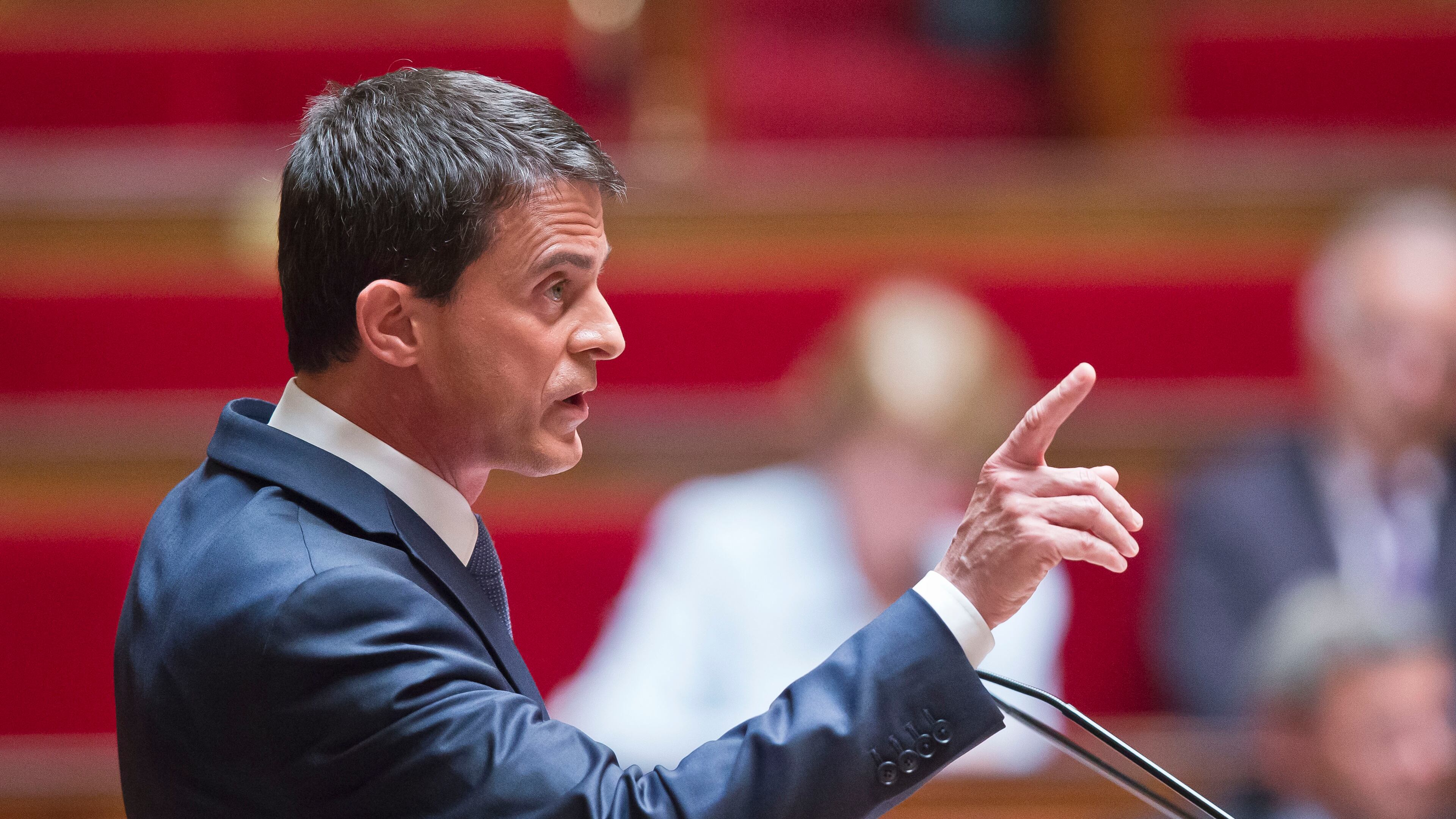 French Prime Minister Manuel Valls delivers a speech during the labor law debate at the national assembly in Paris, France, Thursday, May 12, 2016. France's government is facing a major test as lawmakers hold a no-confidence vote, prompted by a deeply divisive labor law allowing longer workdays and easier layoffs. (AP Photo/Michel Euler)