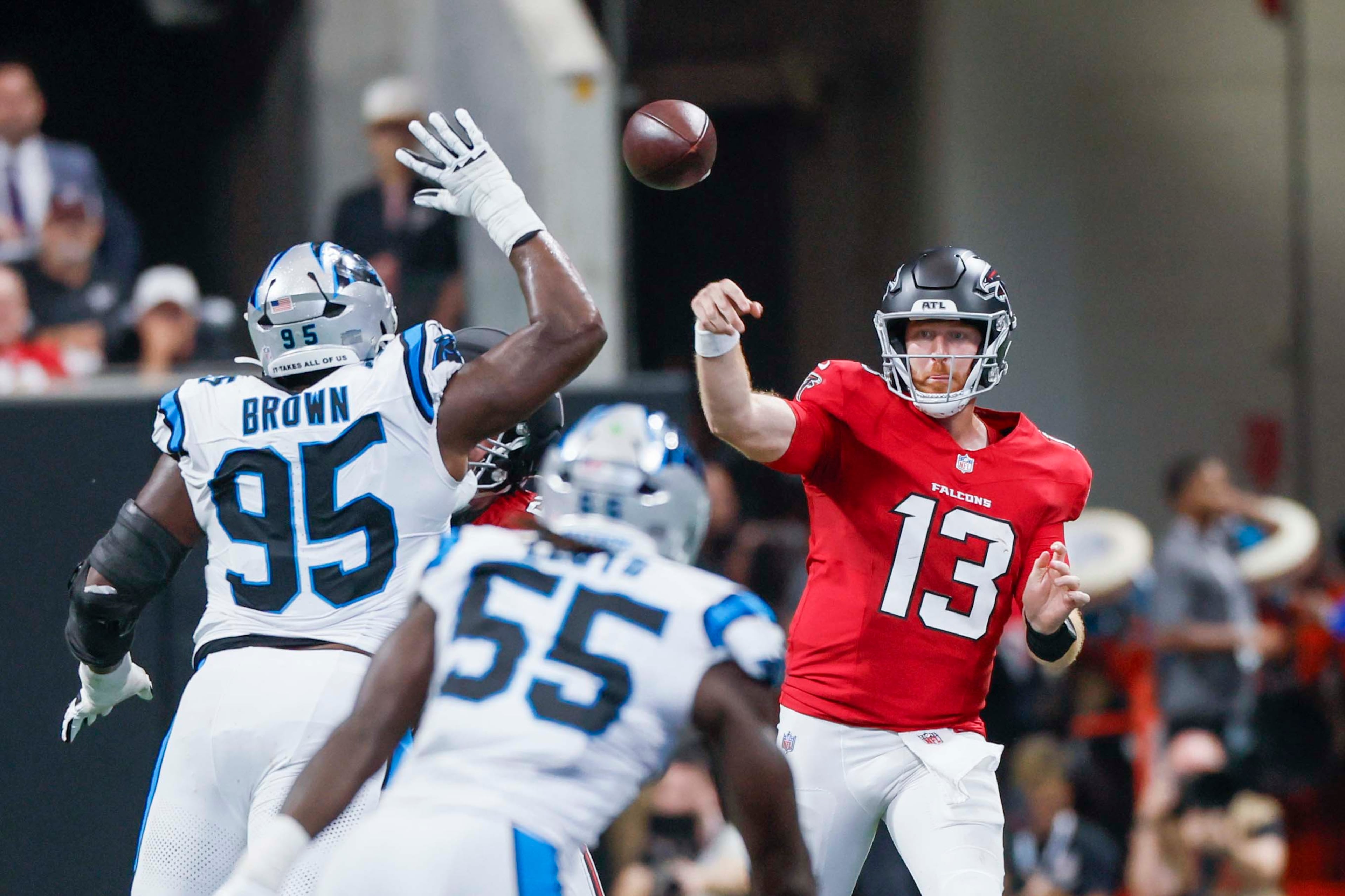 Atlanta Falcons quarterback Cooper Rush (13) attempts a pass in the first half of an NFL game against the Carolina Panthers at Mercedes-Benz Stadium in Atlanta on Sunday, September 20, 2026. (Miguel Martinez/AJC)