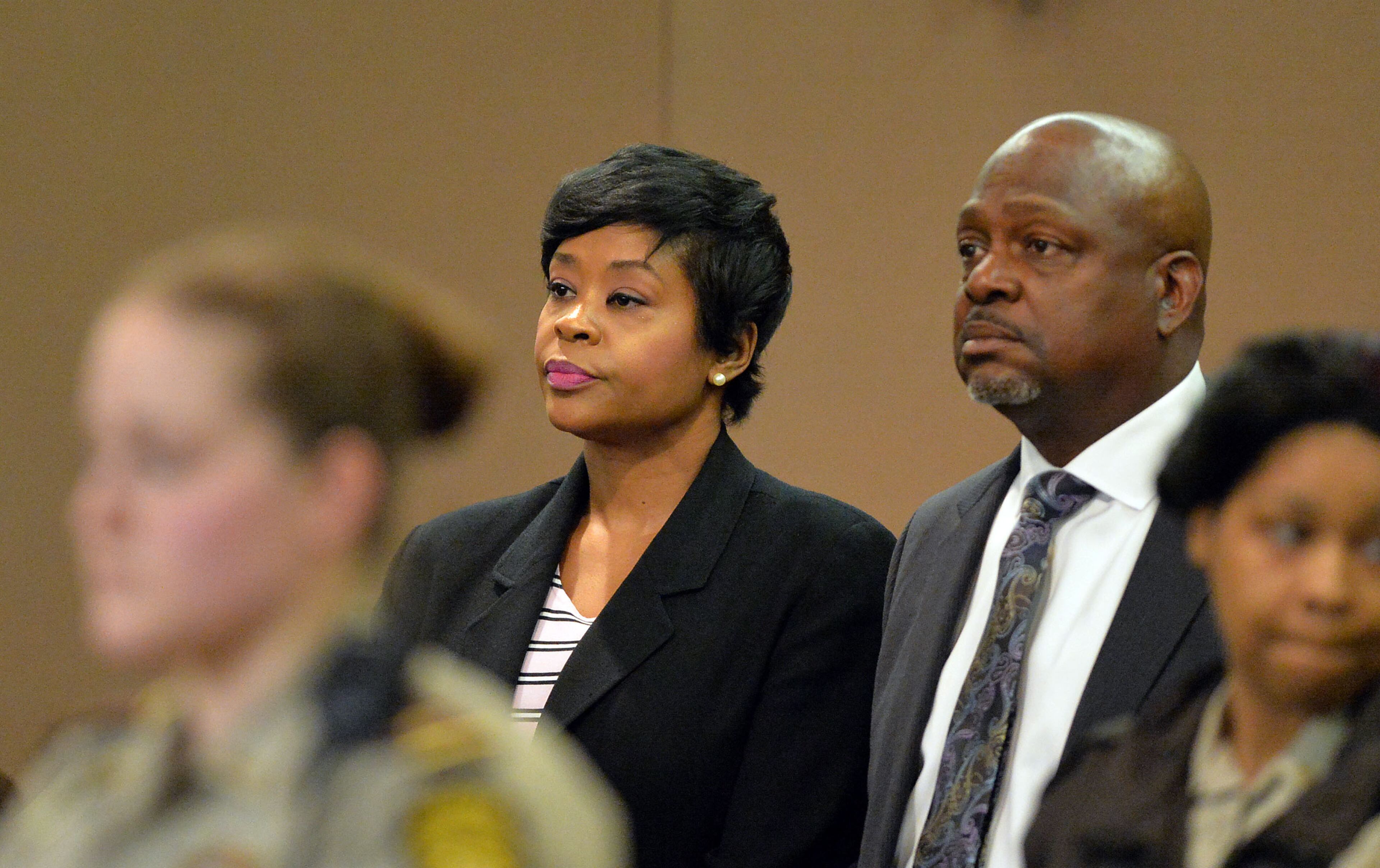 Former APS Deerwood Academy assistant principal Tabeeka Jordan reacts to a guilty verdict as she stands with her defense attorney Akil Secret. A jury of six men and six women render convicted 11 of 12 defendants on RICO and other assorted charges on their eighth day of deliberations in the Atlanta Public Schools test-cheating trial on Wednesday, April 1, 2015. Jurors sorted through roughly five months of testimony against 12 former educators accused of engaging in a racketeering conspiracy to inflate test scores. (Atlanta Journal-Constitution, Kent D. Johnson, Pool)