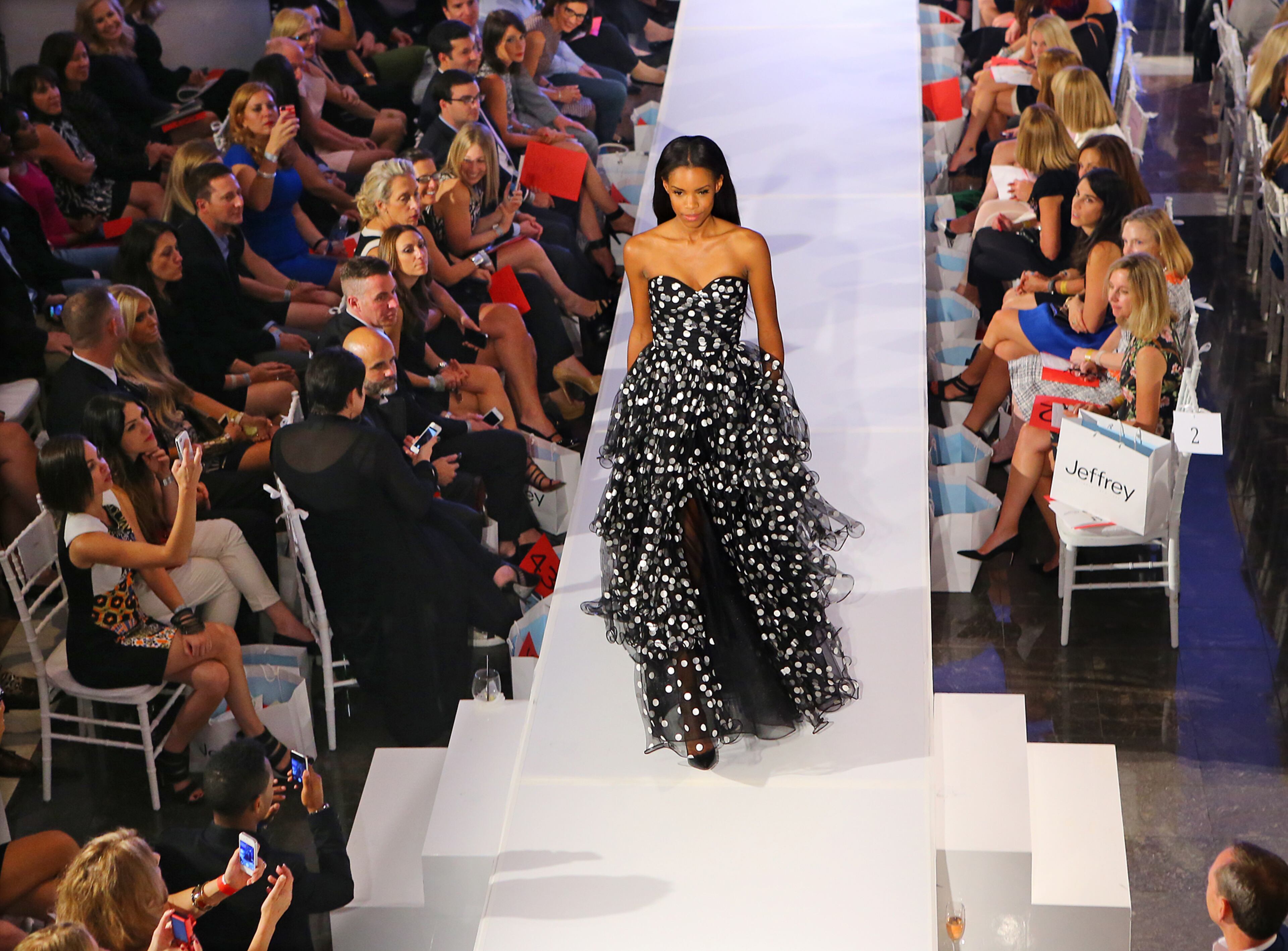 A model in a black and white dress garners some attention during the Jeffrey Cares Fashion Show Monday, Aug. 25, 2014, in Atlanta. The show raises awareness and funds for its beneficiaries the Susan G. Komen for the Cure Greater Atlanta Affiliate and the Atlanta AIDS Fund. CURTIS COMPTON / CCOMPTON@AJC.COM