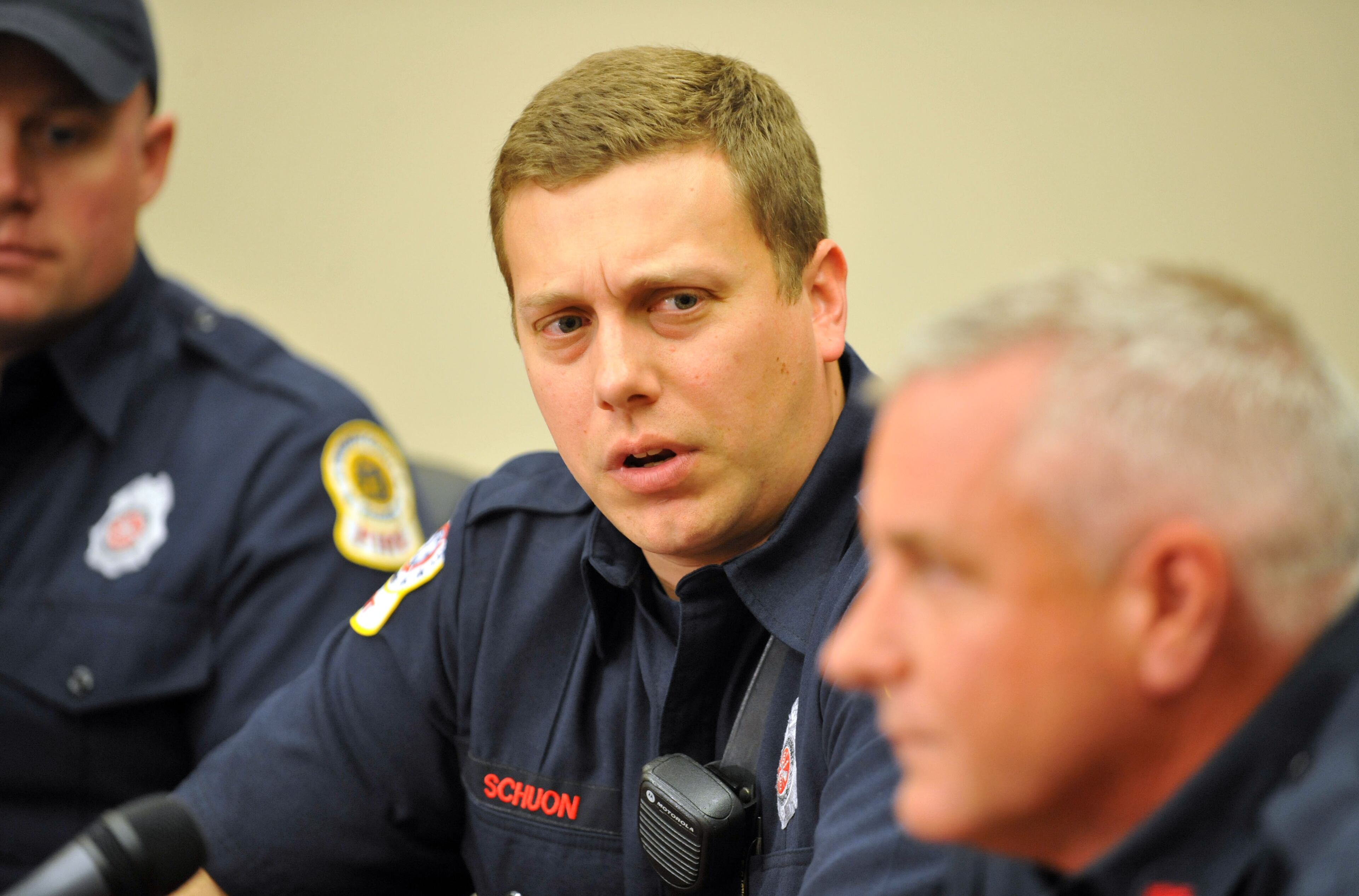 Firefighter Jason Schuon, with the department for a year, talks to the media Tuesday.