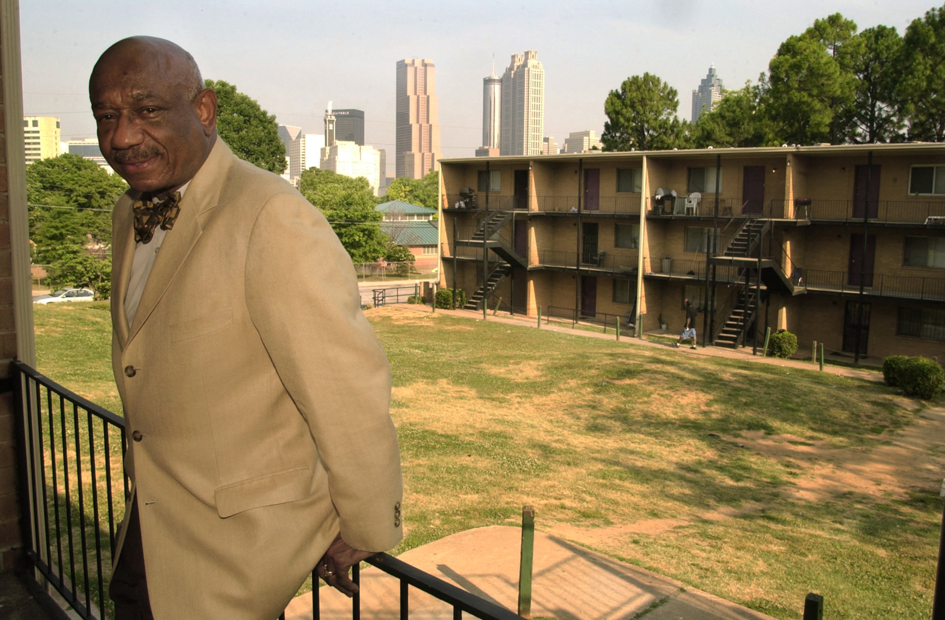 Developer Herman Russell at the Gartrell Courts apartments in Atlanta, one of the first affordable housing communities developments that Russell helped develop. Russell is shown there in 2006. AJC FILE