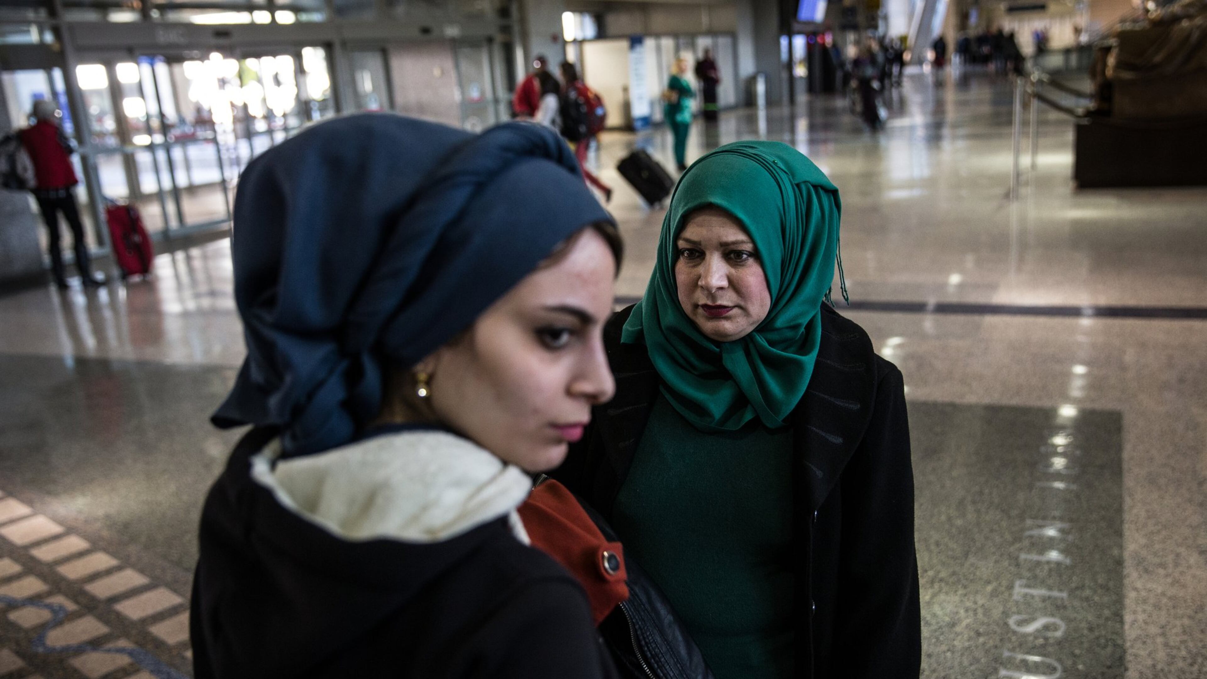 Noor Mohanad Majbal, 21, and her mother Nagham Abd Alstaar, refugees from Iraq, wait for their family to collect their luggage after arriving at Austin-Bergstrom International Airport on Feb. 15, 2017. The family was initially denied entry into the U.S. because of President Trump’s first travel ban. (Tamir Kalifa/ AMERICAN-STATESMAN)