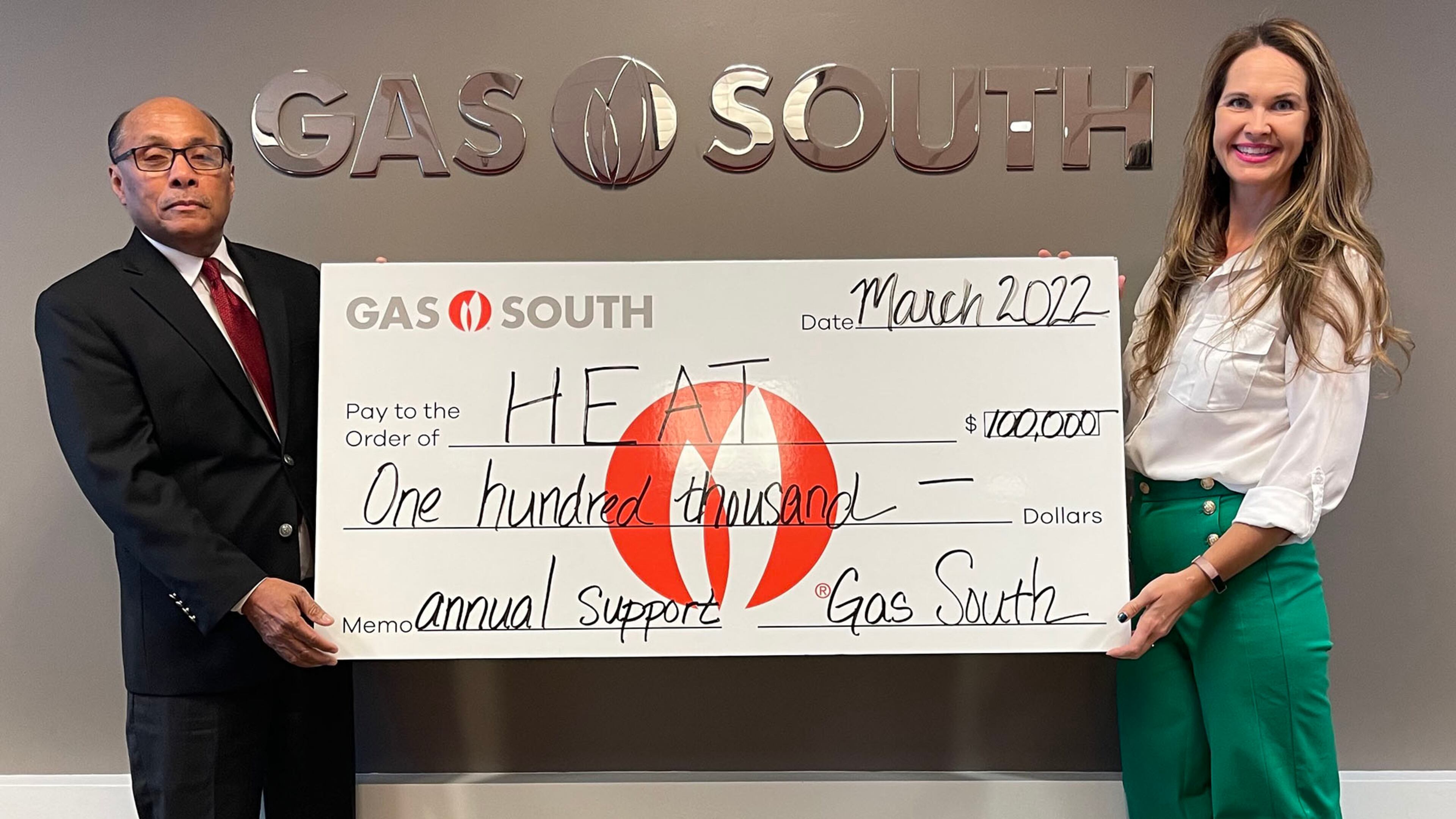 HEAT Executive Director Jeffery Joseph is pictured with Carley Stephens, Gas South's manager of community affairs. Gas South recently gifted HEAT with a
$100,000 donation for 2022 to assist in their mission to help people in need with their energies needs.