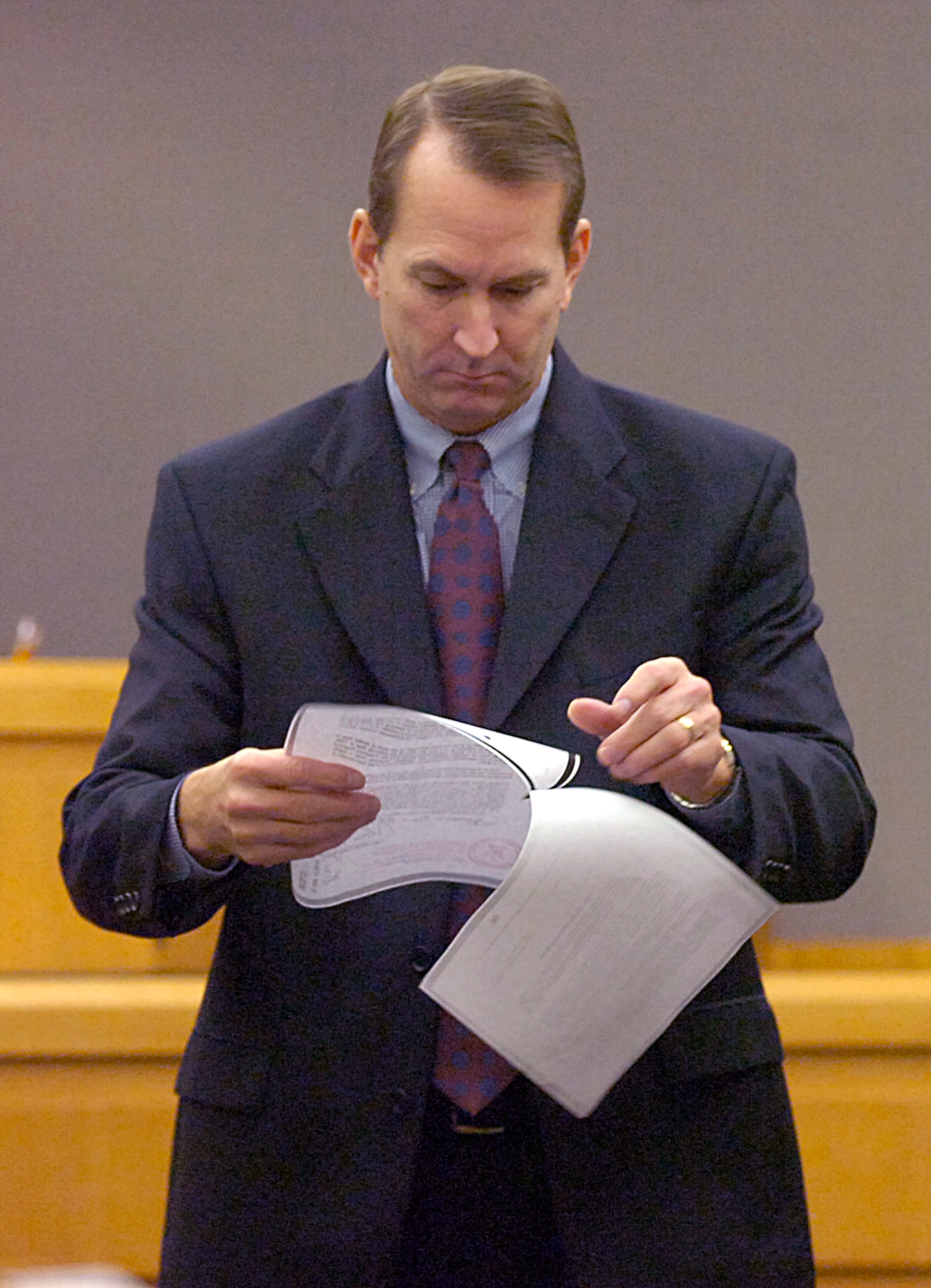 Assistant district attorney, Marty First looking over some evidence that he is going to present at the trial of Khalid Adem. (NICK ARROYO/AJC staff)