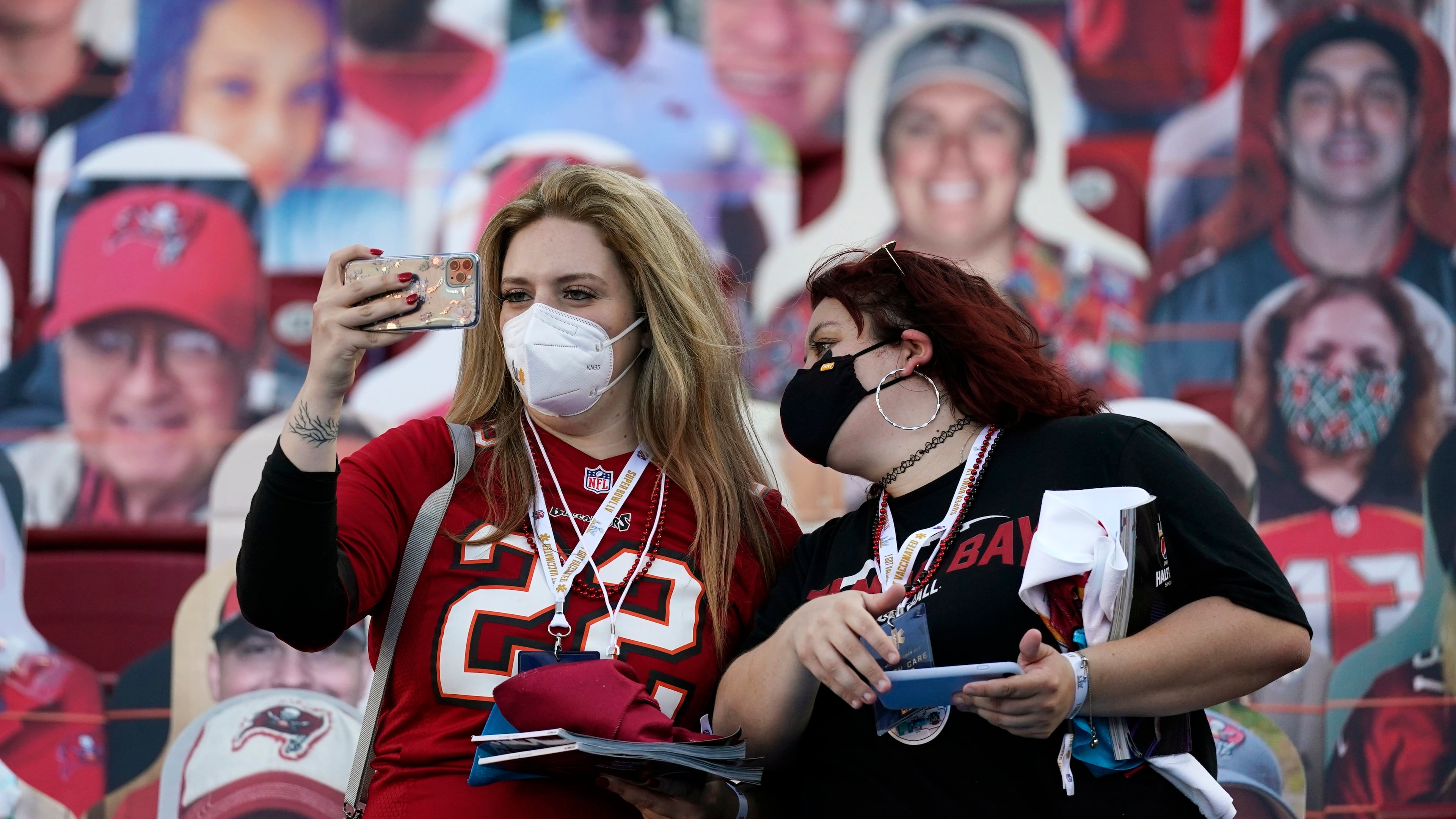 Tampa Bay Buccaneers fans take photos - amid dozens of fan cutouts - before Super Bowl 55 Sunday, Feb. 7, 2021, in Tampa, Fla. (Ashley Landis/AP)