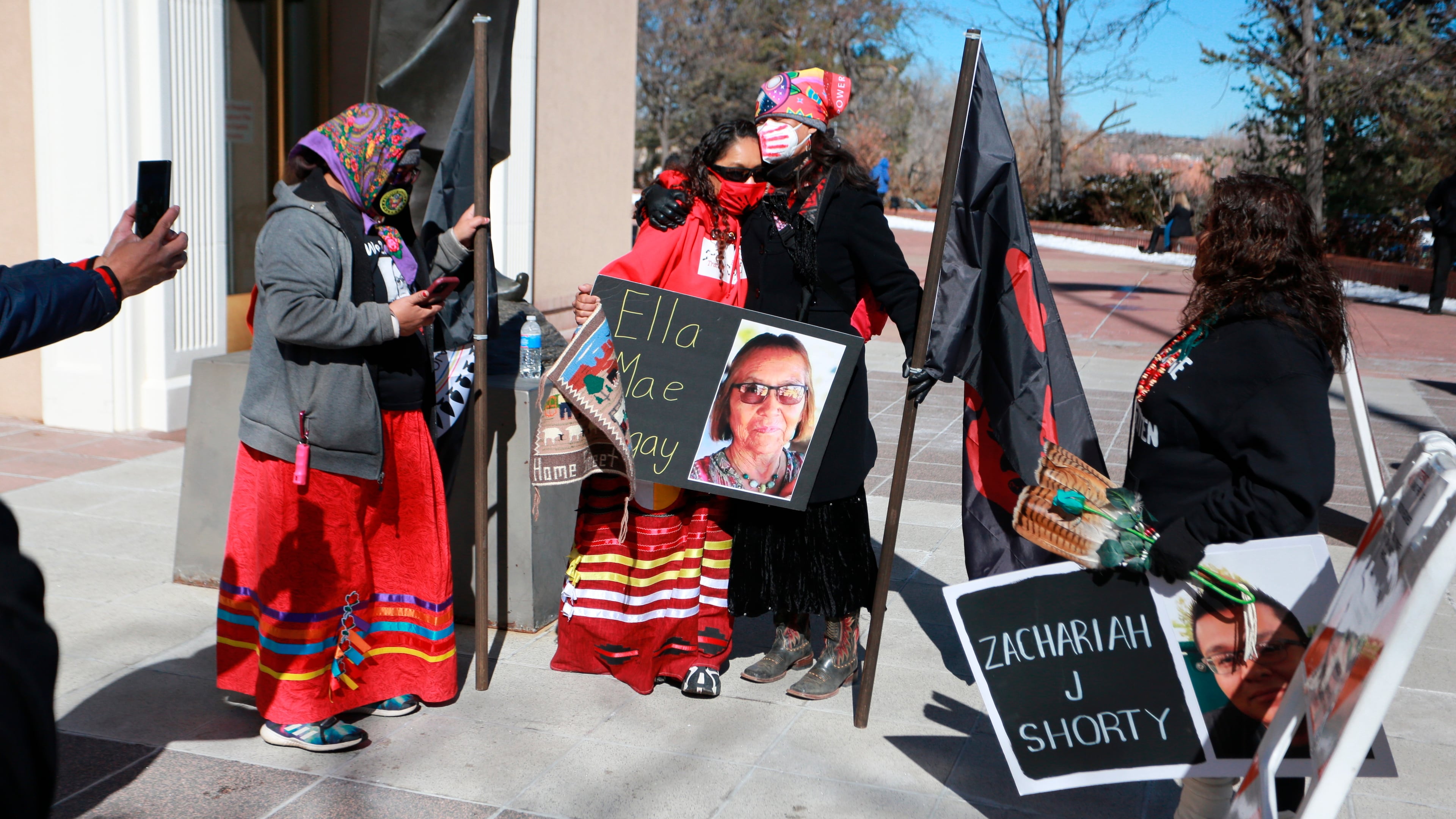 FILE - Seraphine Warren, center left, is embraced by state Sen. Shannon Pinto outside the state capitol building on Feb. 4, 2022, in Santa Fe, N.M. (AP Photo/Cedar Attanasio, File)