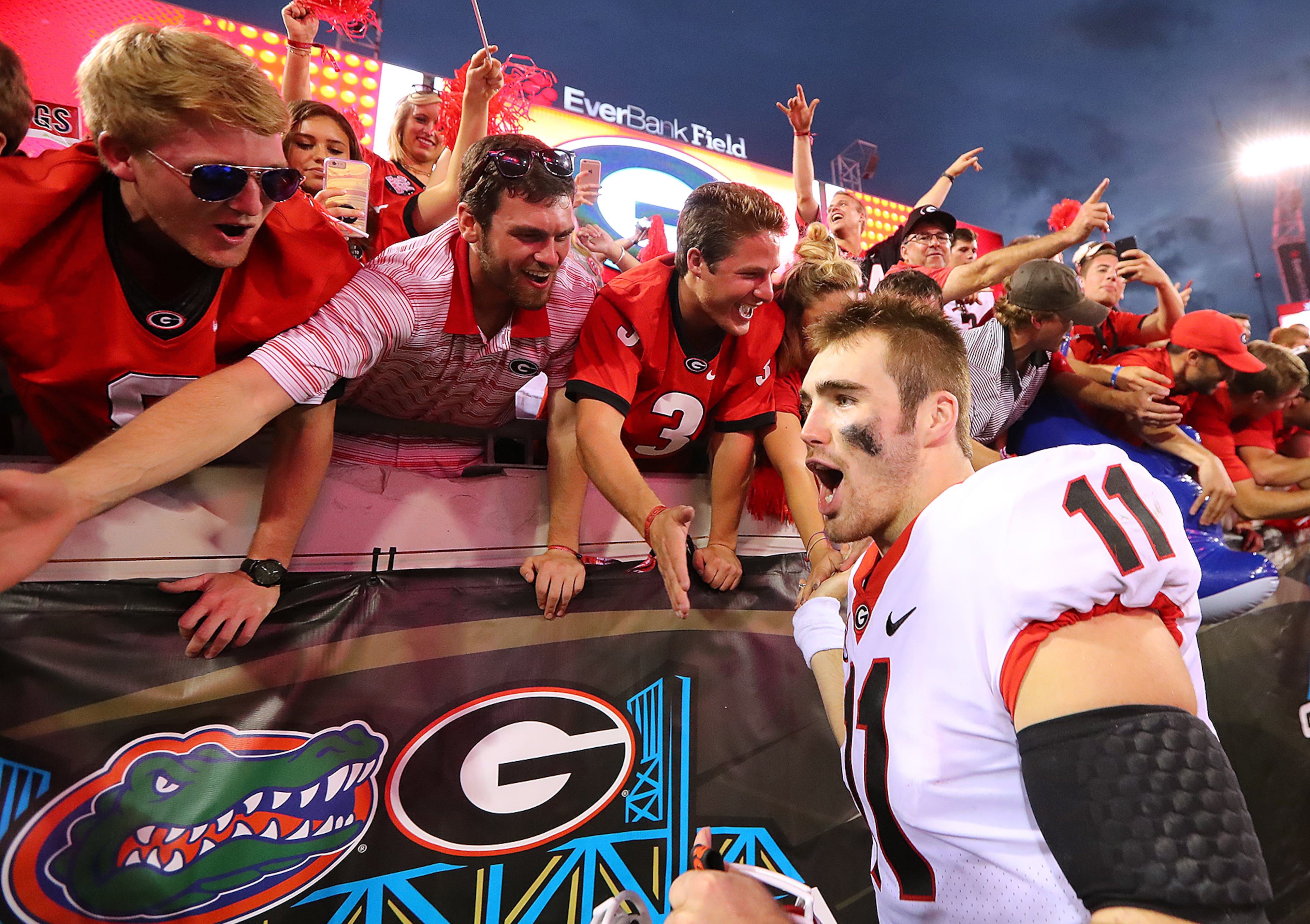 October 28, 2017 Jacksonville: Georgia quarterback Jake Fromm celebrates a 42-7 victory over Florida with fans in a NCAA college football game on Friday, October 27, 2017, in Jacksonville. Georgia beat Florida 42-7. Curtis Compton/ccompton@ajc.com