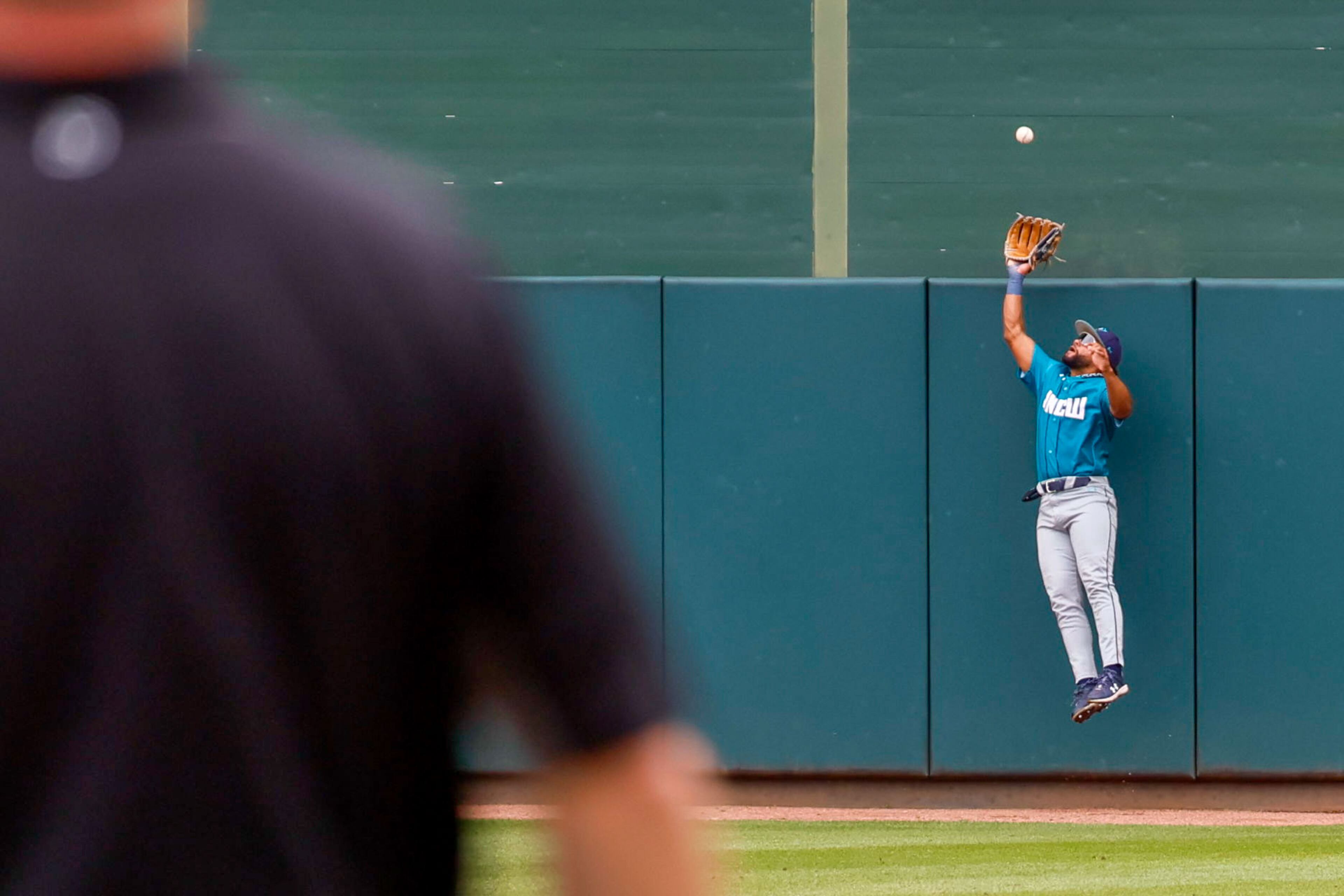 UNC Wilmington center fielder Trevor Marsh elevates to steal a home run by Georgia Tech right fielder Bobby Zmarzlack during the third inning during the NCAA Tournament Regional at Foley Field on Sunday, June 2, 2024, in Athens.
(Miguel Martinez / AJC)