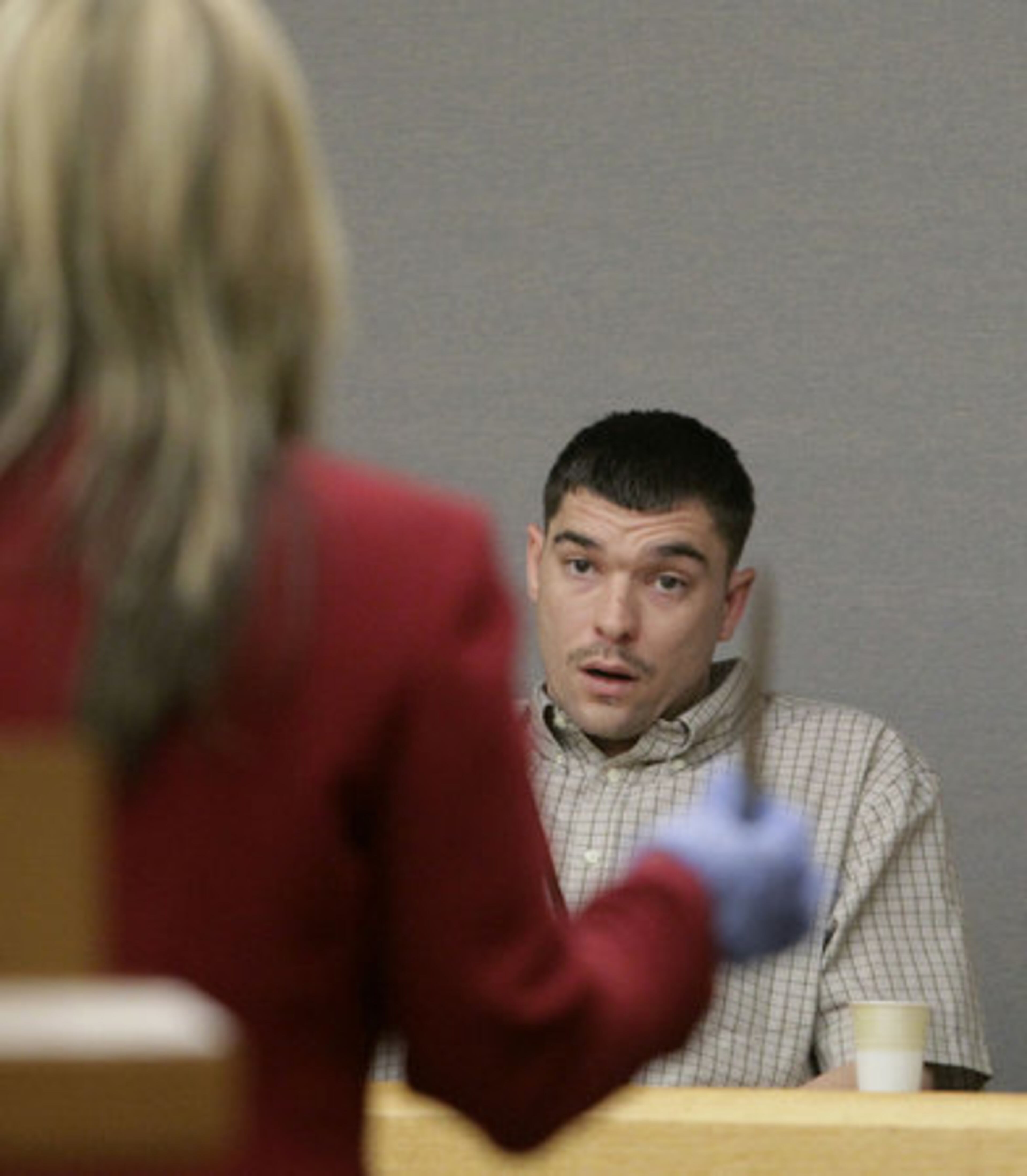 Assistant District Attorney Christa Kirk confronts Phillip Dunn with the murder knife during cross examination