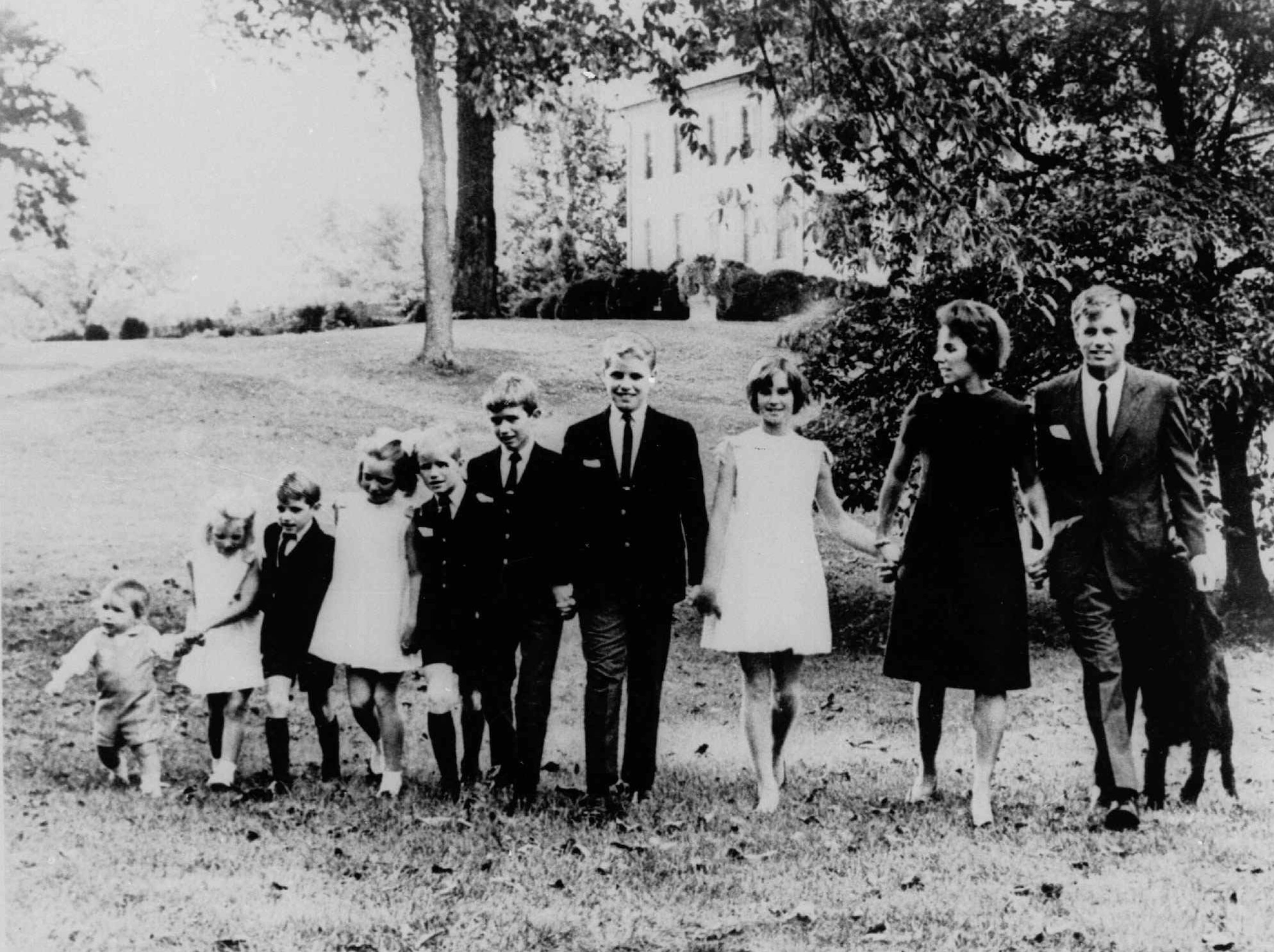 Senator Robert F. Kennedy and Ethel Kennedy pose with eight of their nine children on the lawn of their home at McLean, Va., in this October 15, 1966, file photo. From right: Kathleen, 15; Joseph, 14; Robert Jr, 13; David, 11; Mary Courtney, 10; Michael, 8; Kerry, 7; and Christopher, 3. Matthew 21-months is not show. Michael Kennedy, 39, was killed in a skiing accident during a family outing in Aspen, Colo., according to a statement from the ski resort Wednesday, Dec. 31, 1997. Kennedy is the second of the eleven children born to the Kennedy's to die under tragic circumstances. His brother David died in Florida in 1984 of a drug overdose. (AP Photo)