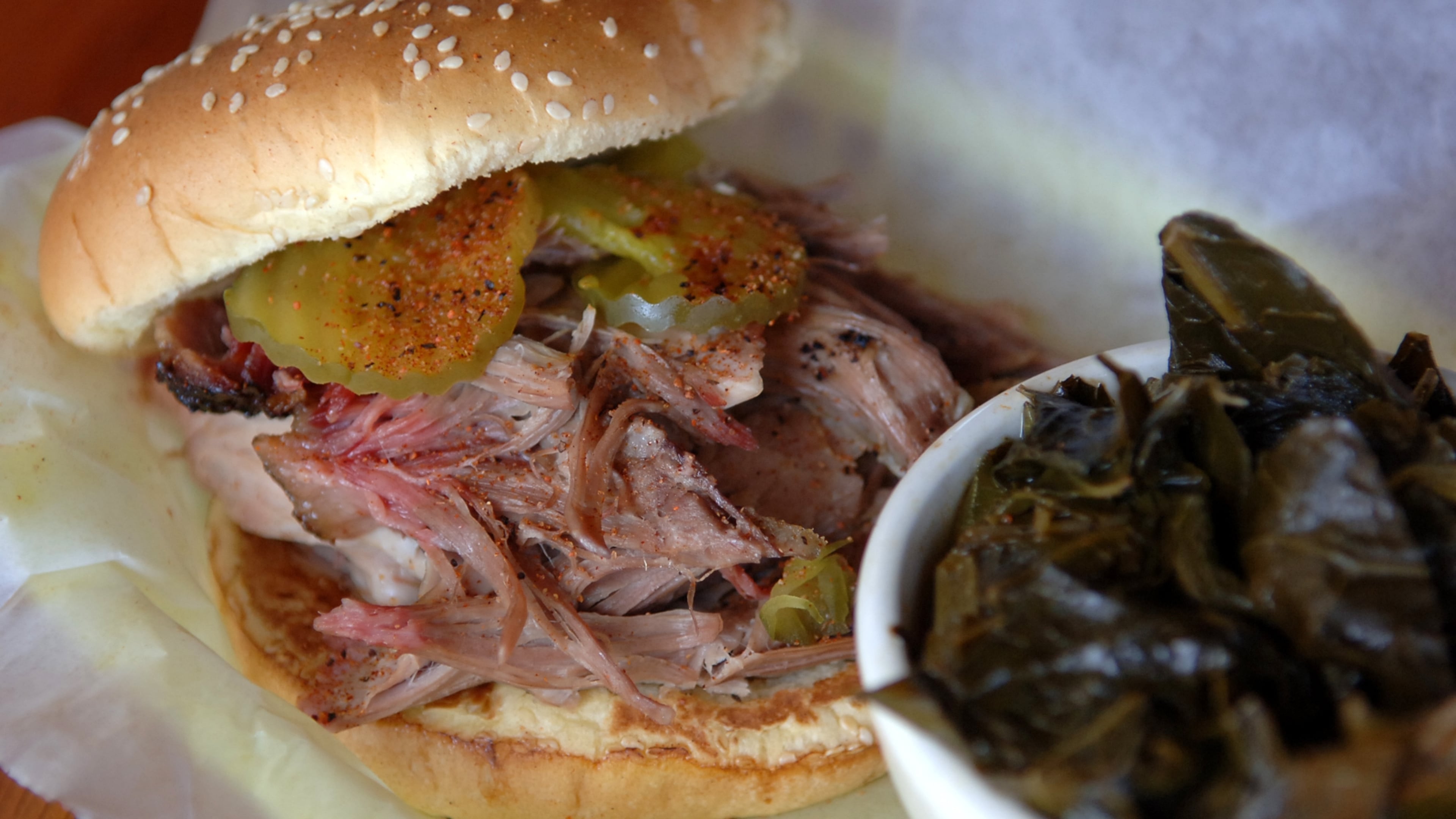 A pulled pork sandwich from Fox Bros. Bar-B-Q is one of six finalists for the Best Pulled Pork Sandwich in Atlanta. The blind taste test took place Thursday, June 18, 2026. (Becky Stein for the AJC)