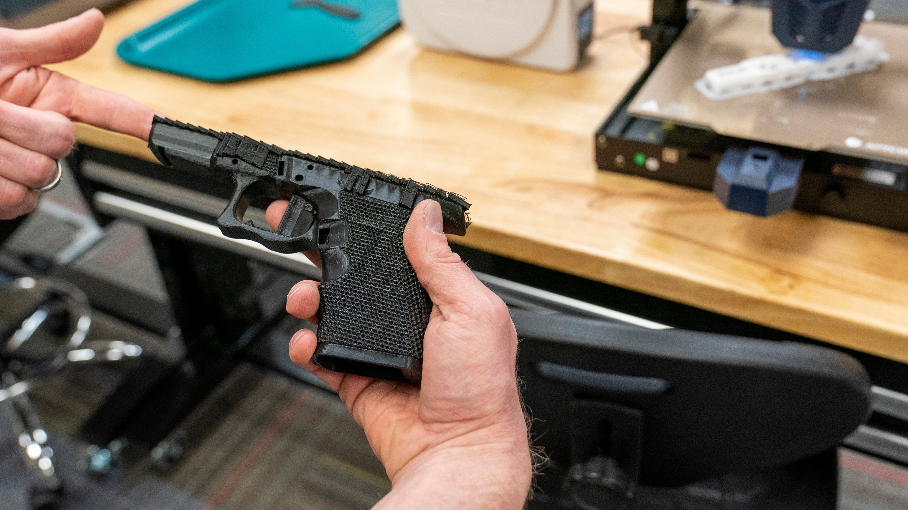 FILE - A handgun frame that has been printed on a 3D printer is held for a photograph at the Bureau of Alcohol, Tobacco, Firearms, and Explosives (ATF), National Services Center, March 2, 2023, in Martinsburg, W.Va. (AP Photo/Alex Brandon, File)