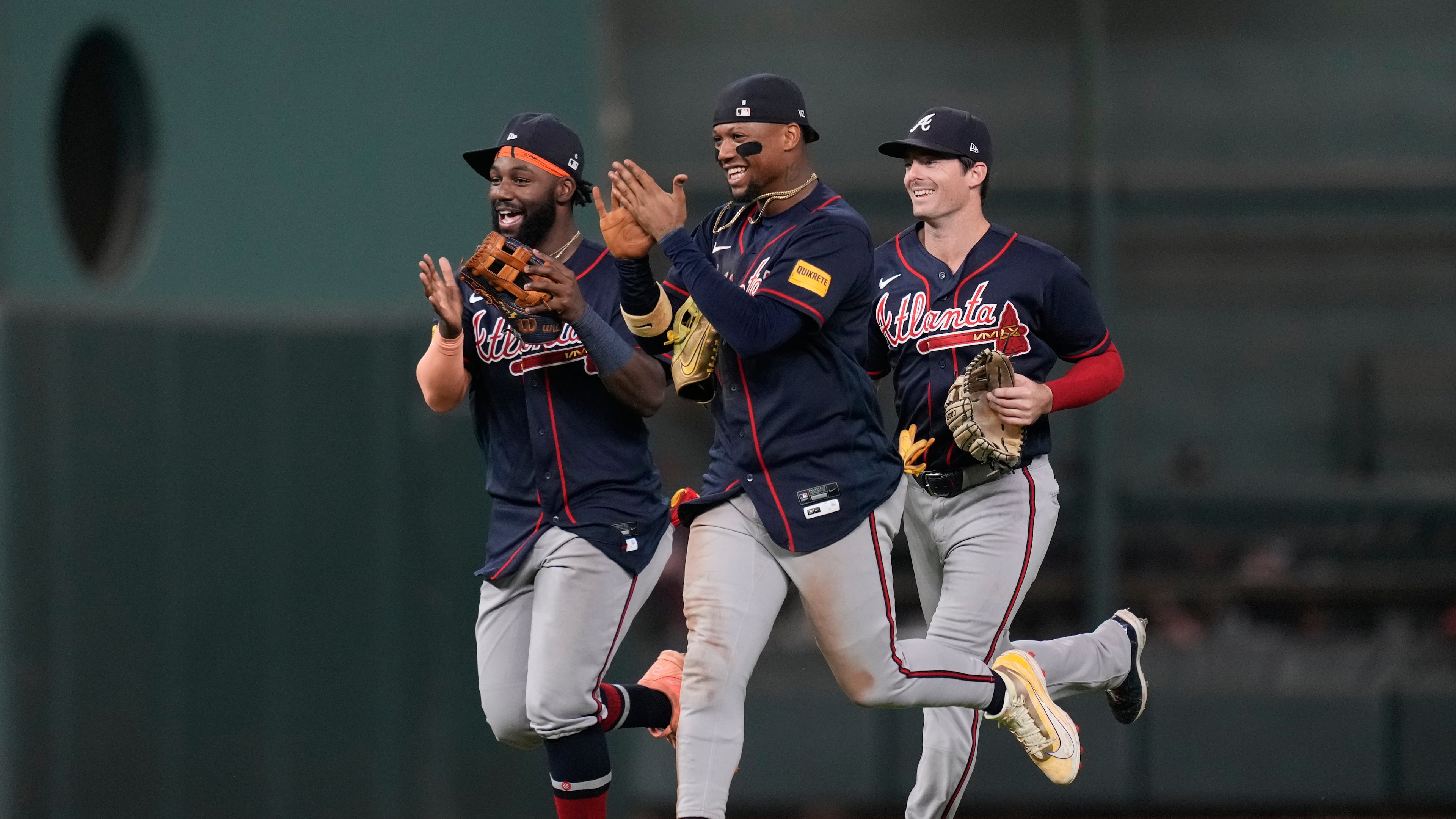 Braves center fielder Michael Harris II (left), right fielder Ronald Acuña Jr. (center) and left fielder Mike Yastrzemski celebrate after beating the Astros in Houston on Saturday, Sept. 19, 2026. (Ashley Landis/AP)