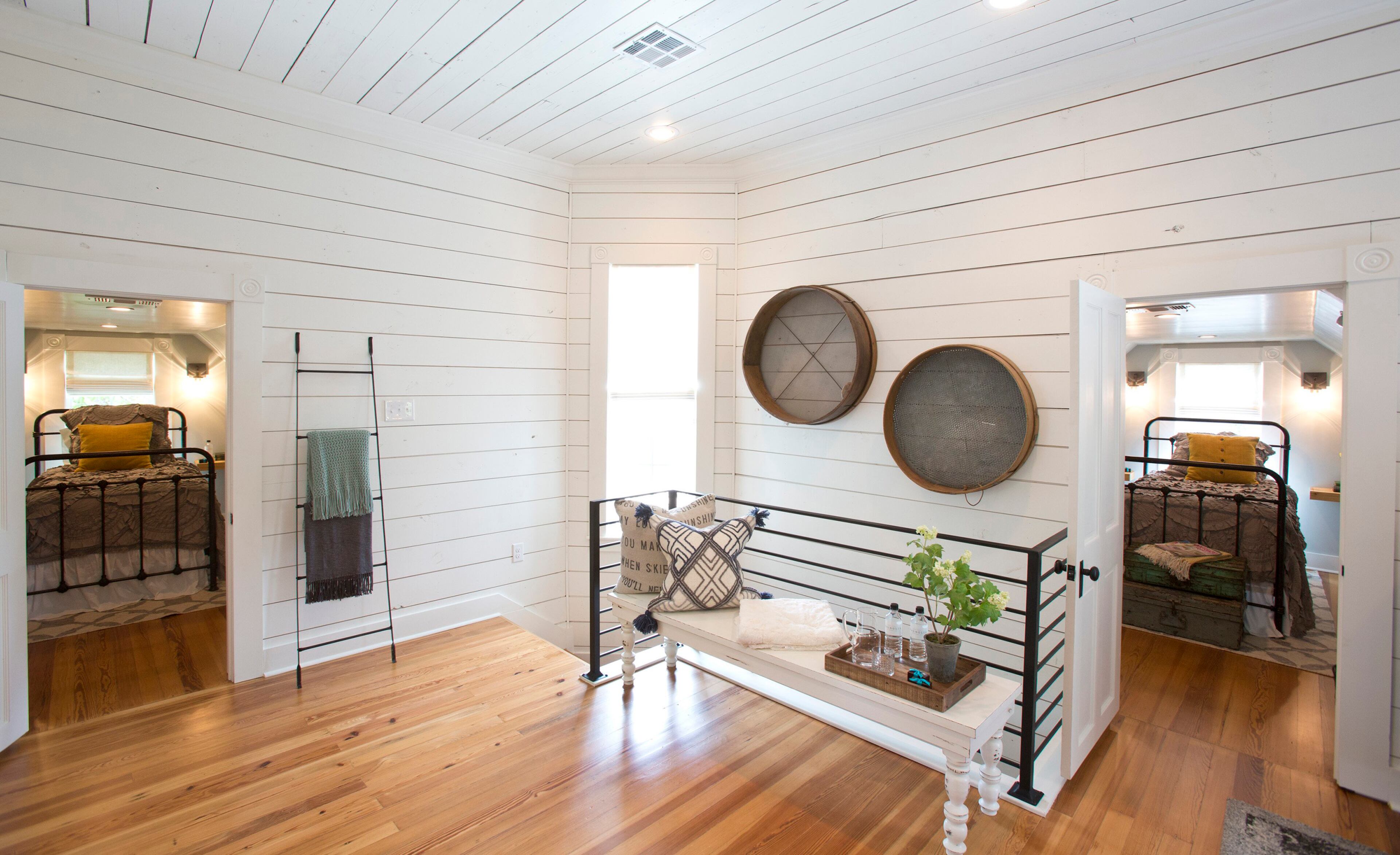 At the top of the stairs is a spacious landing that got new wood flooring, white shiplap, a bench seat and a modern railing. (Ross Hailey/Fort Worth Star-Telegram/TNS)