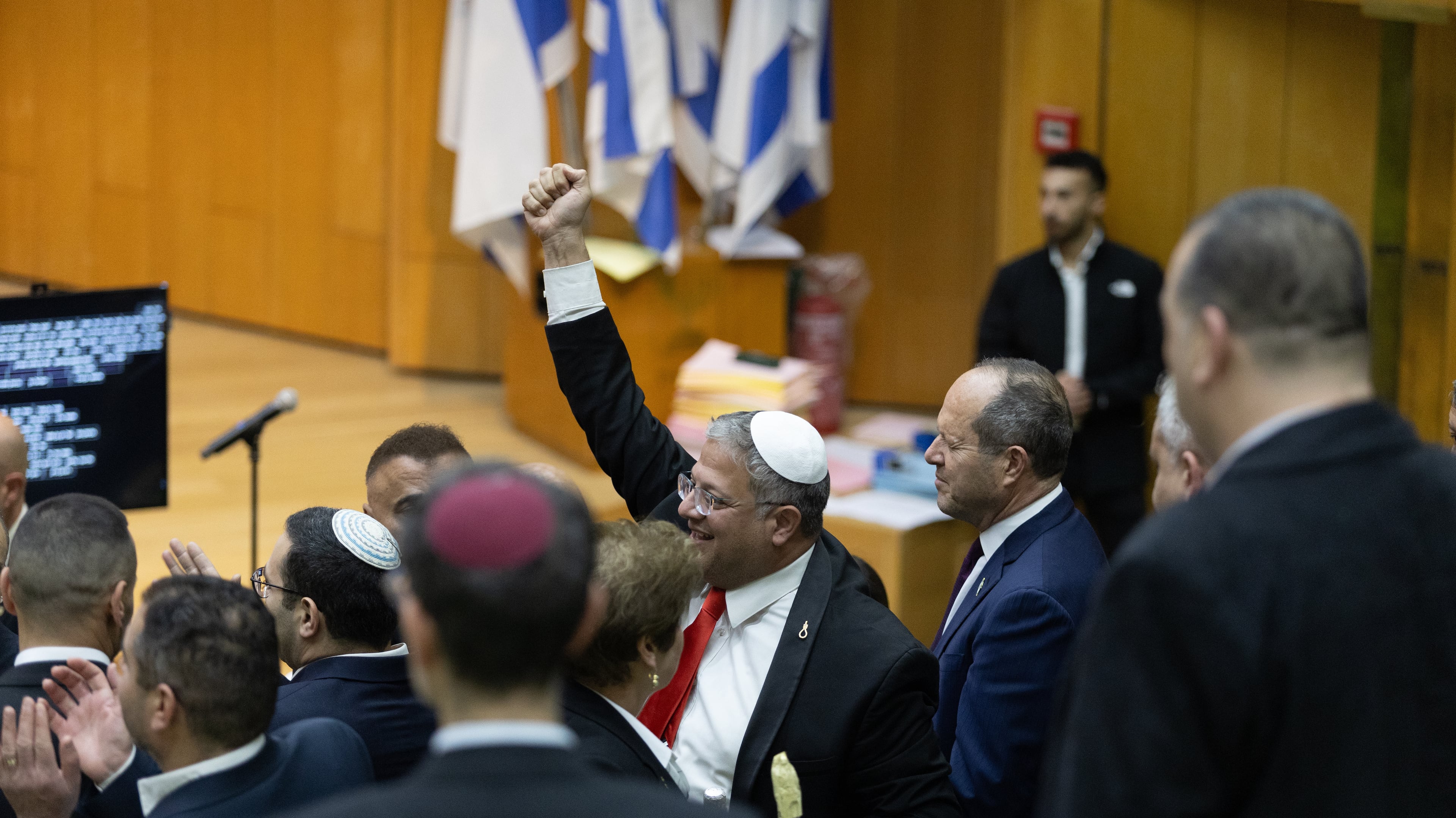 Israel's Minister of National Security, Itamar Ben-Gvir, center, and lawmakers celebrate after Israel's parliament passed a law approving the death penalty for Palestinians convicted of murdering Israelis, at the Knesset in Jerusalem Monday, March 30, 2026. (AP Photo/Itay Cohen)