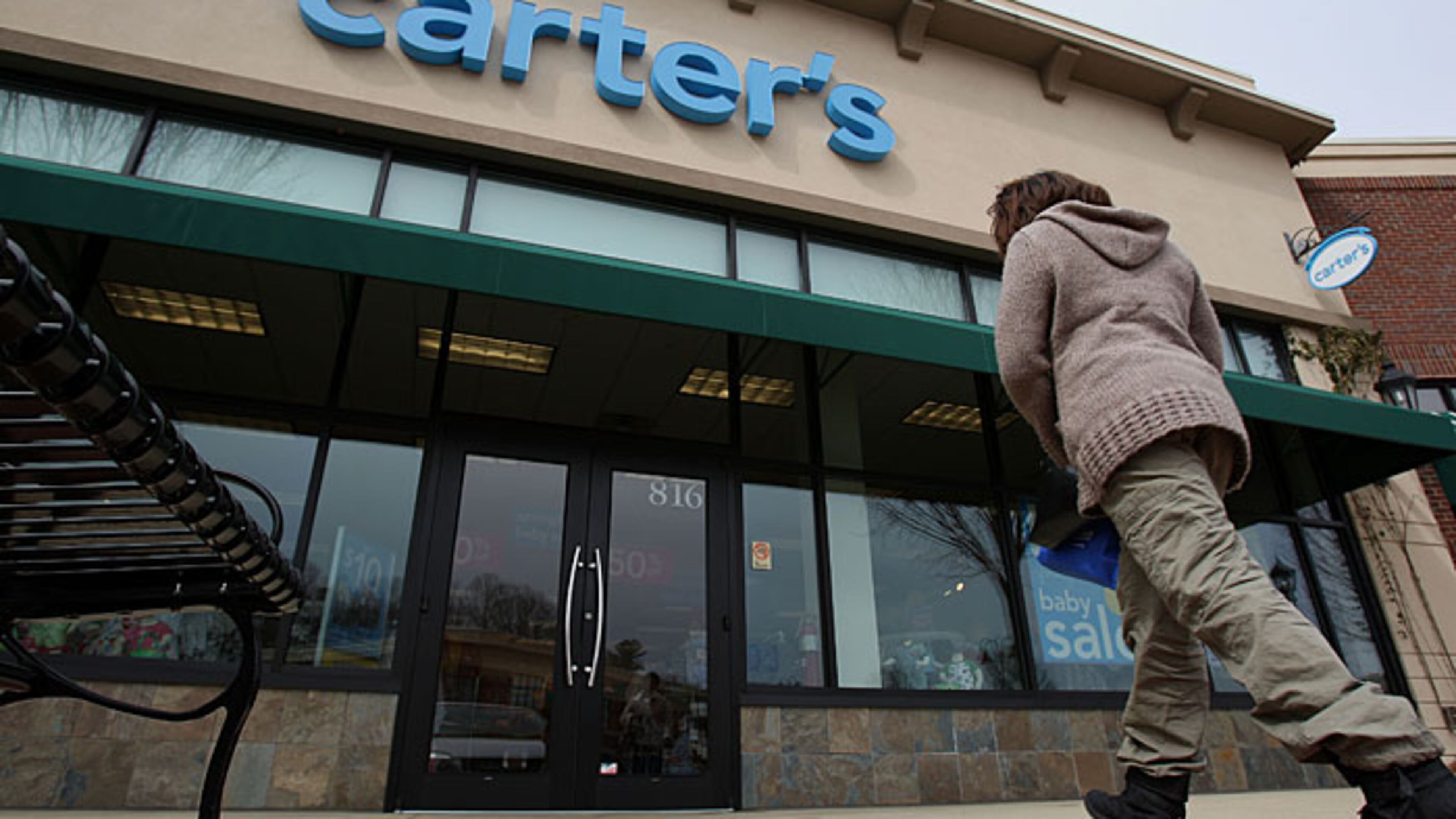 A woman walks into a Carter's store. Carter's CFO Richard Westenberger said its back-to-school clothes and accessories could cost more because of tariffs. (File)