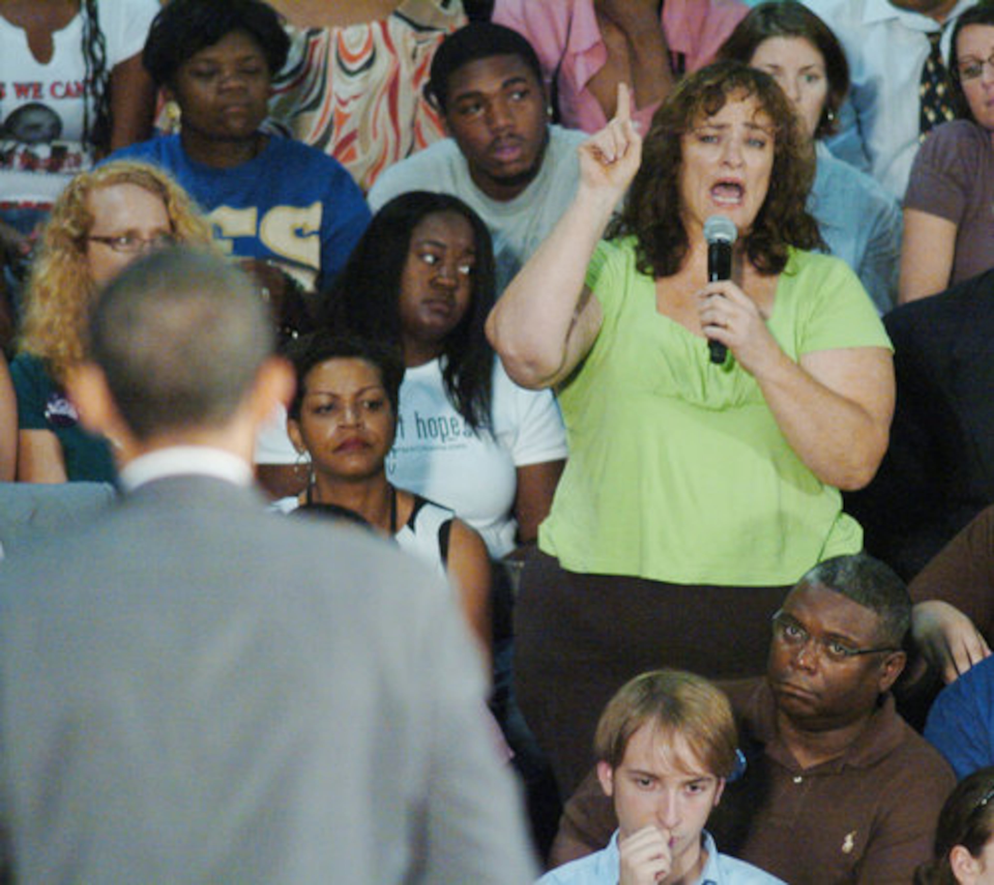 At McEachern High School, U.S. Sen. Barack Obama, the presumptive Democratic nominee for president listens to tearful comments by a woman identified only as "Gina" who recounted her efforts to climb back from bankruptcy and foreclosure.