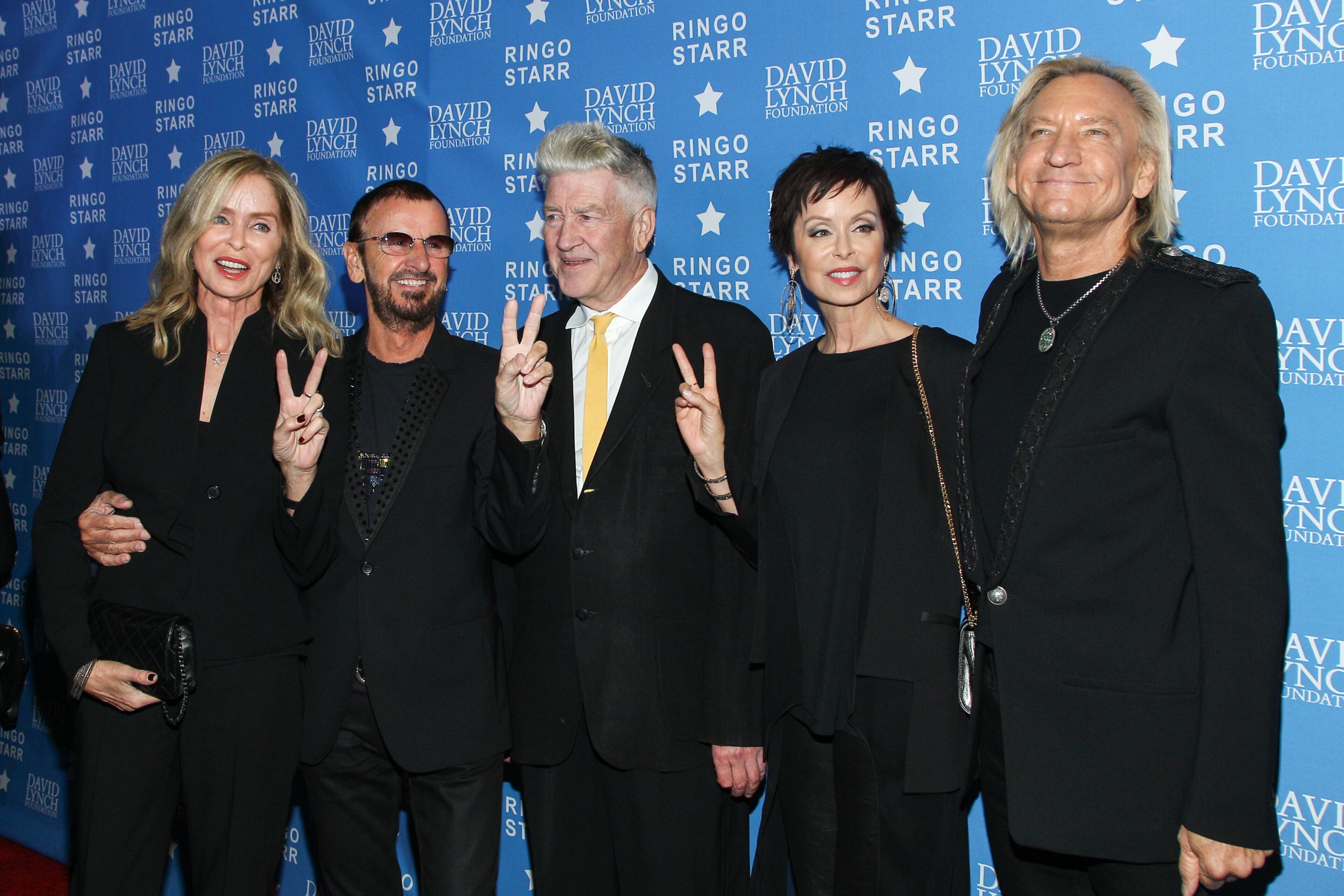 From left, actress Barbara Bach, musician Ringo Starr, David Lynch, Marjorie Bach, and musician Joe Walsh attend the David Lynch Foundation Honors Ringo Star "A Lifetime of Peace & Love" event held at the El Rey Theatre, Monday, Jan. 20, 2014, in Los Angeles.