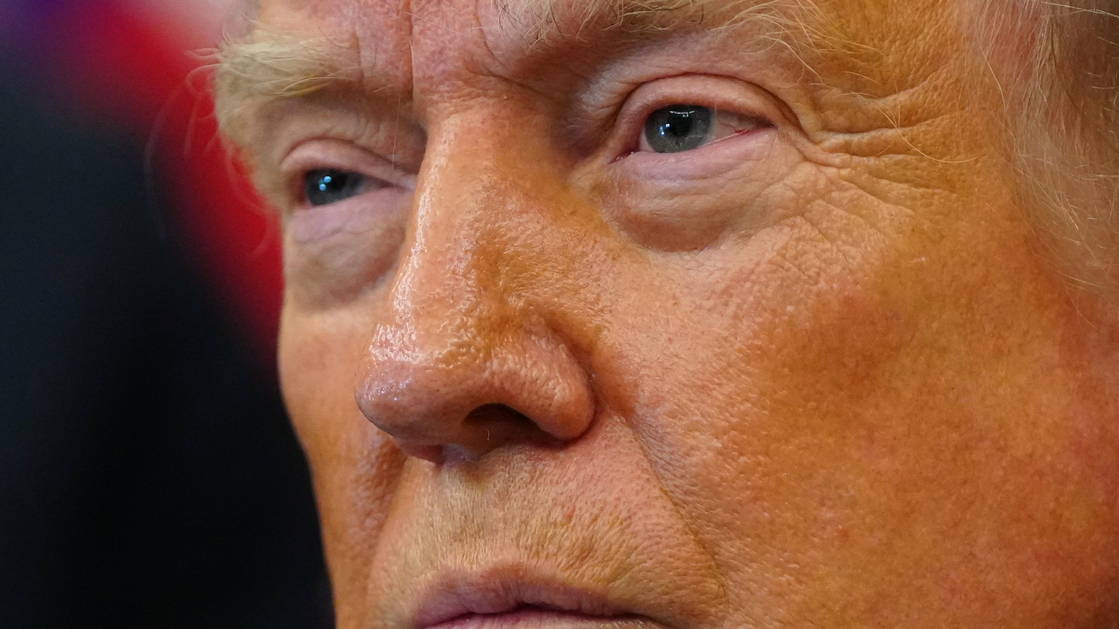President Donald Trump listens after signing executive orders modifying the Bears Ears National Monument and the Grand Staircase-Escalante National Monument in the Oval Office of the White House, Monday, July 13, 2026, in Washington. (AP Photo/Julia Demaree Nikhinson)